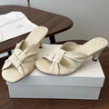 THE ROW 26S KNOT HEELED SLIDE SANDALS 35MM IN IVORY WHITE LAMBSKIN