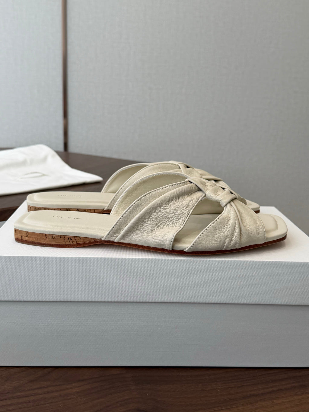THE ROW 26S KNOT SLIDE SANDALS IN IVORY WHITE LAMBSKIN