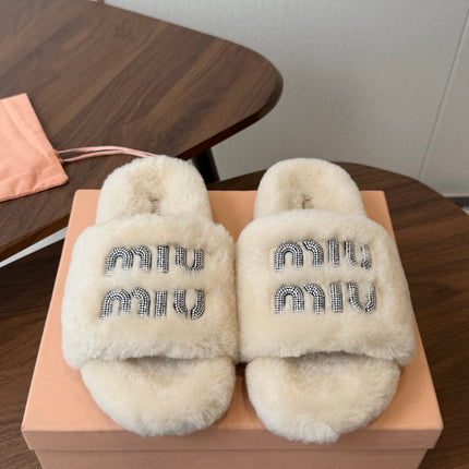 MIUMIU 26S CRYSTAL LOGO SLIDES IN LIGHT BEIGE SHEARLING