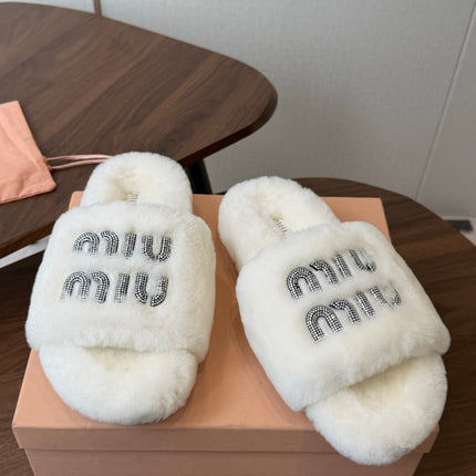 MIUMIU 26S CRYSTAL LOGO SLIDES IN WHITE SHEARLING