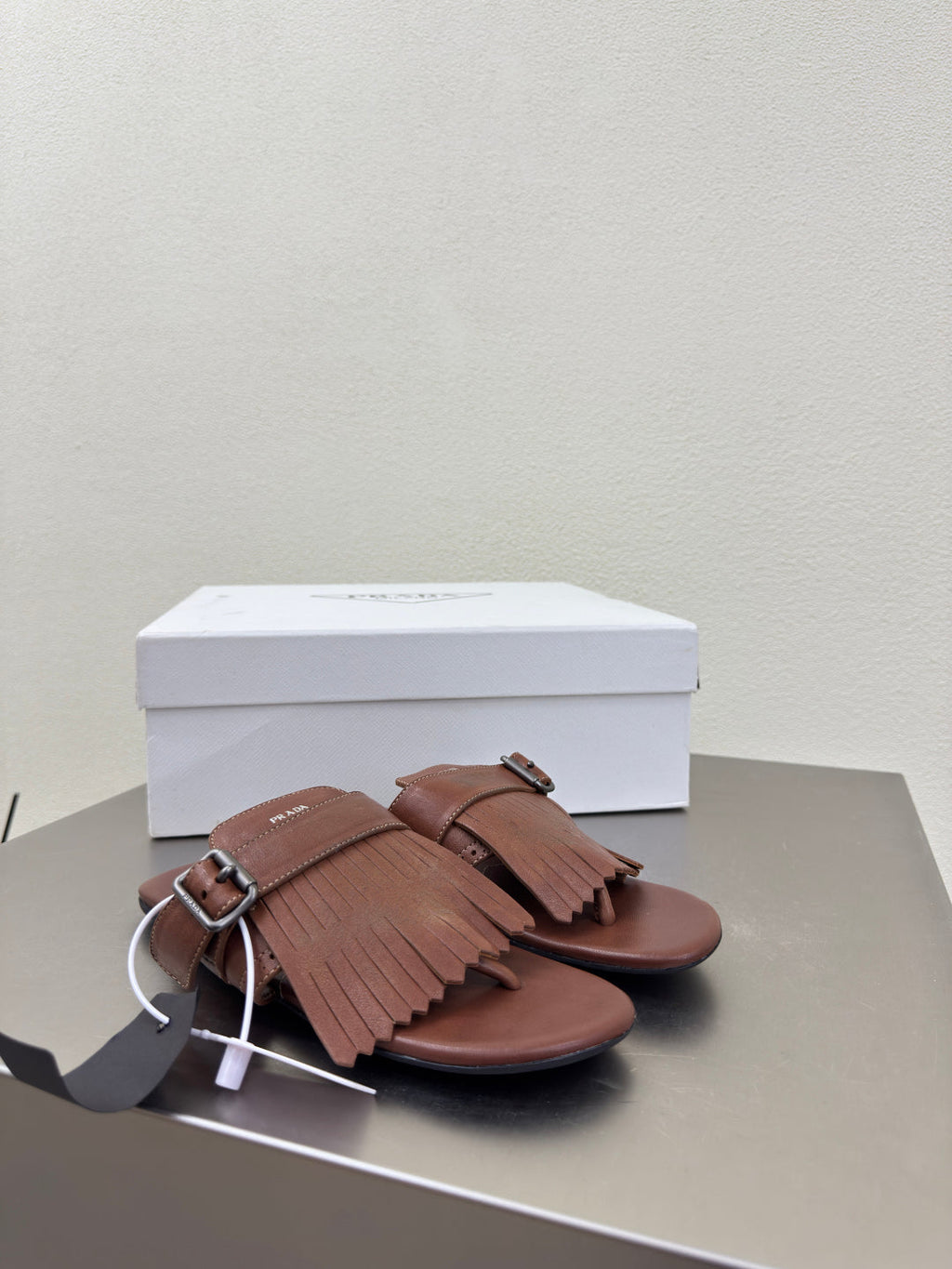 PRADA 25S SHUFFLE LEATHER THONG SANDALS IN SIENNA CALFSKIN