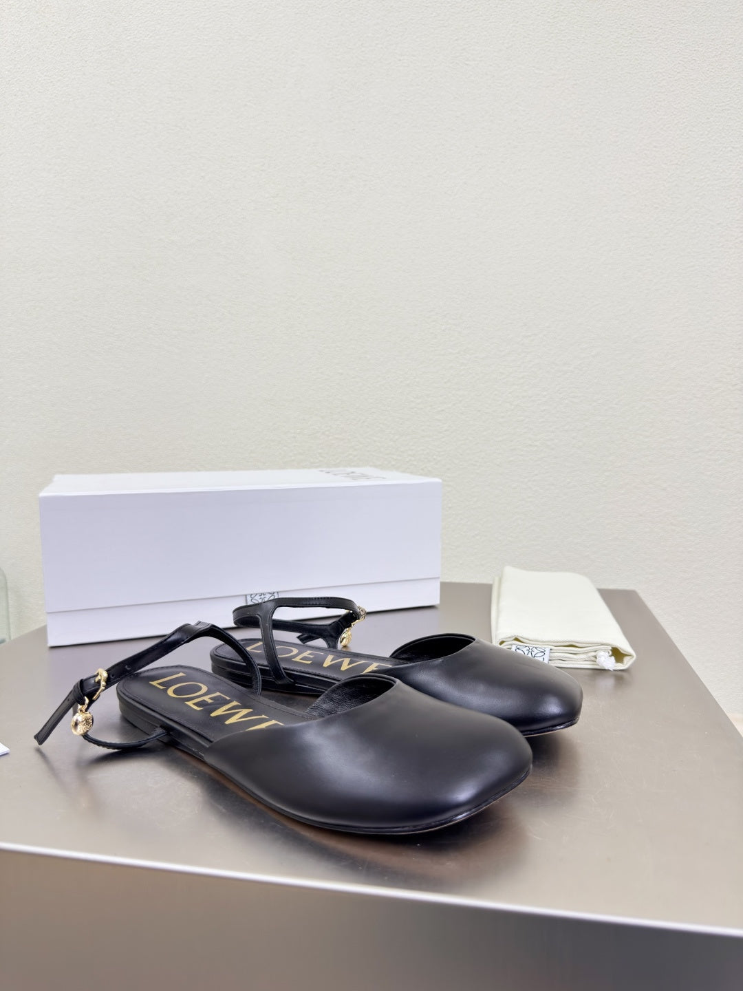 LOEWE 26S SLINGBACK FLAT PUMPS IN BLACK CALFSKIN