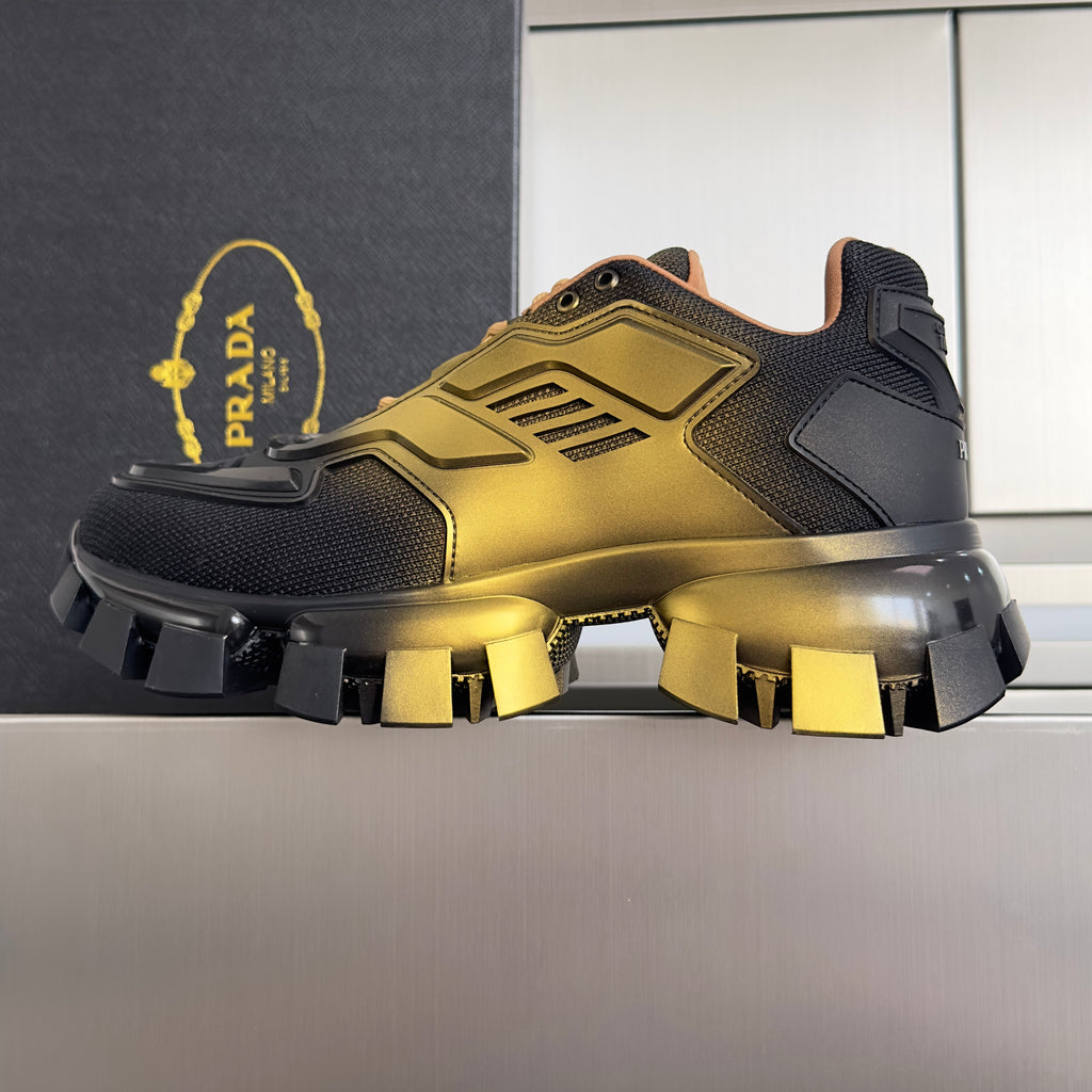 PRADA 26S CLOUDBUST THUNDER SNEAKERS 60MM IN BLACK AND GOLD MESH FABRIC AND TPU