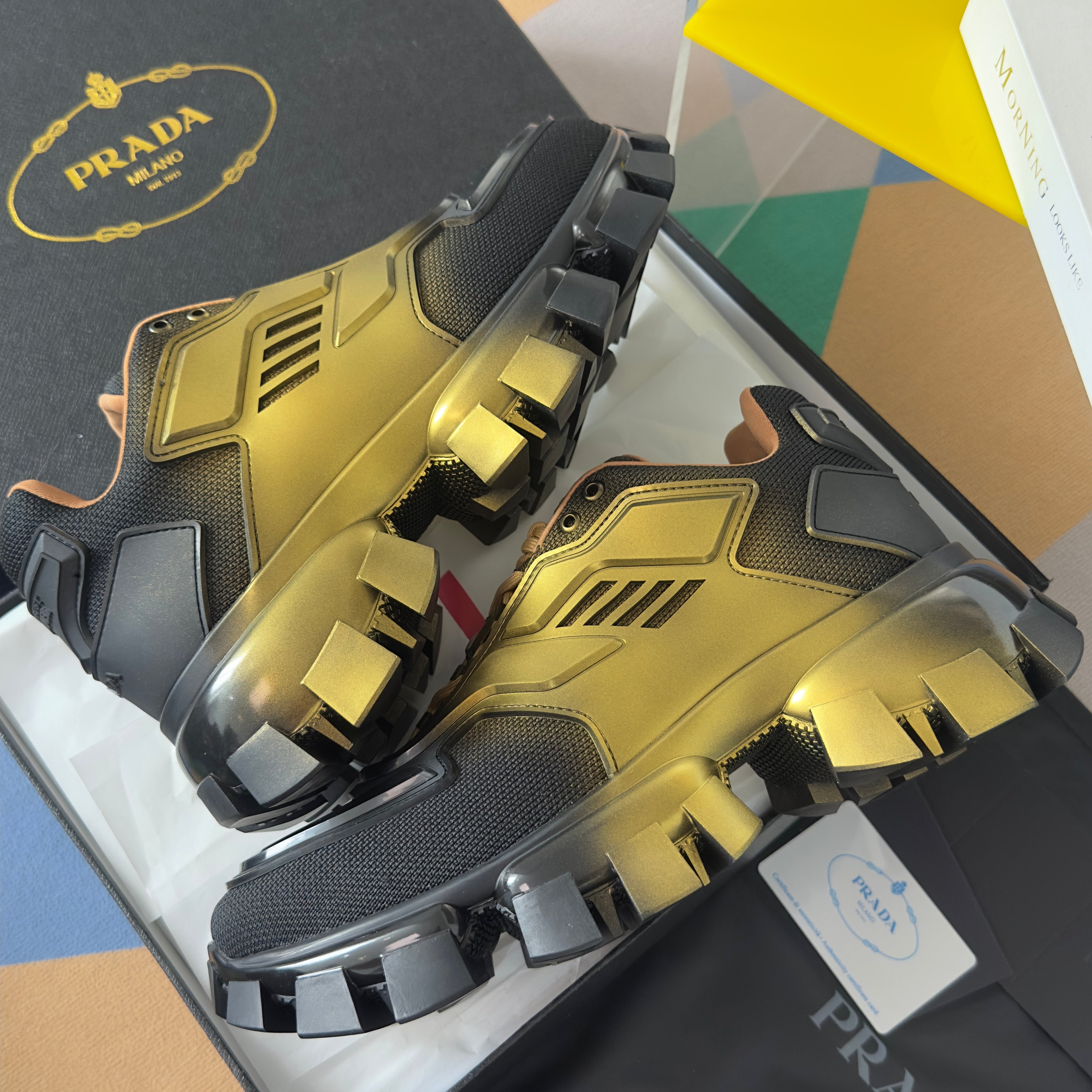 PRADA 26S CLOUDBUST THUNDER SNEAKERS 60MM IN BLACK AND GOLD MESH FABRIC AND TPU