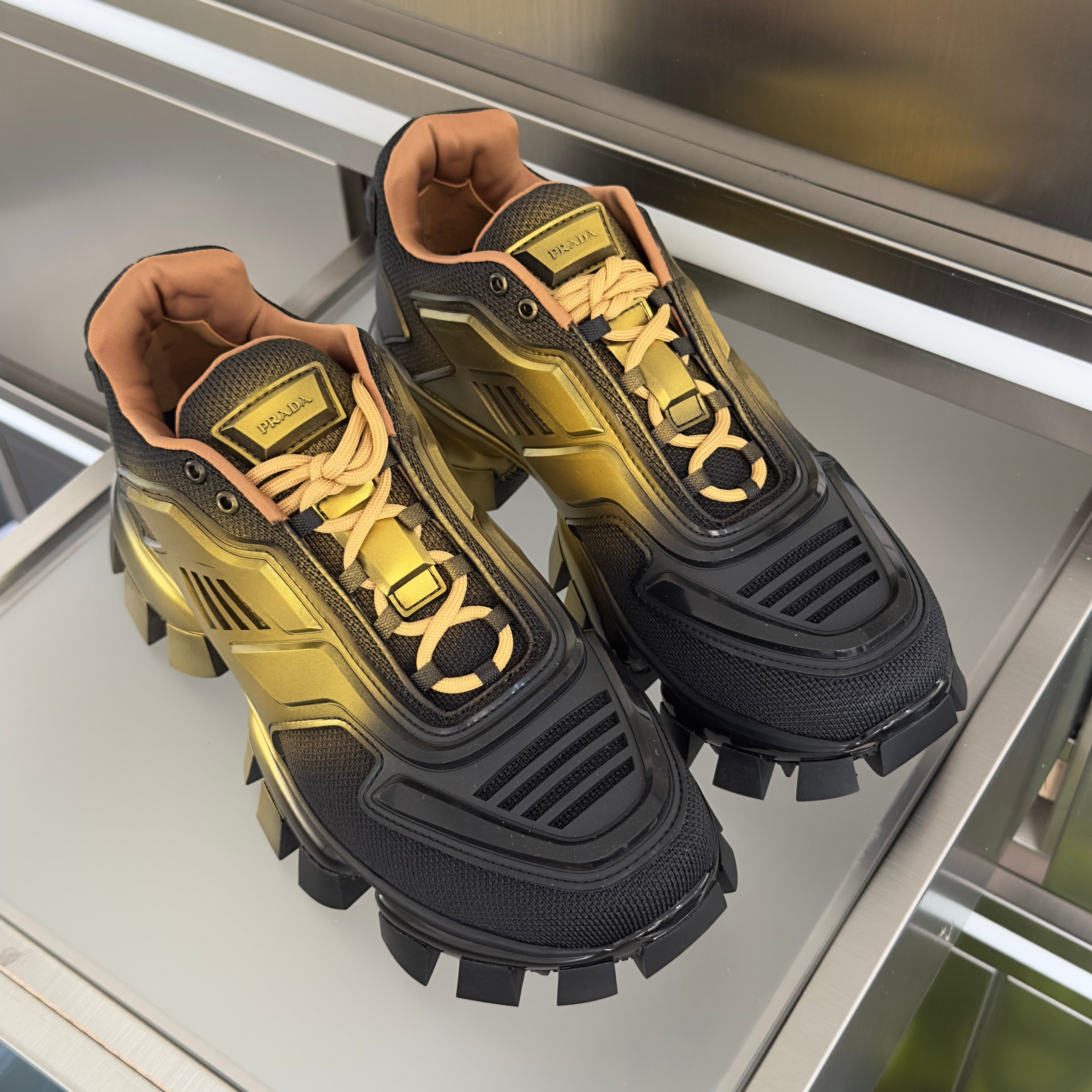PRADA 26S CLOUDBUST THUNDER SNEAKERS 60MM IN BLACK AND GOLD MESH FABRIC AND TPU