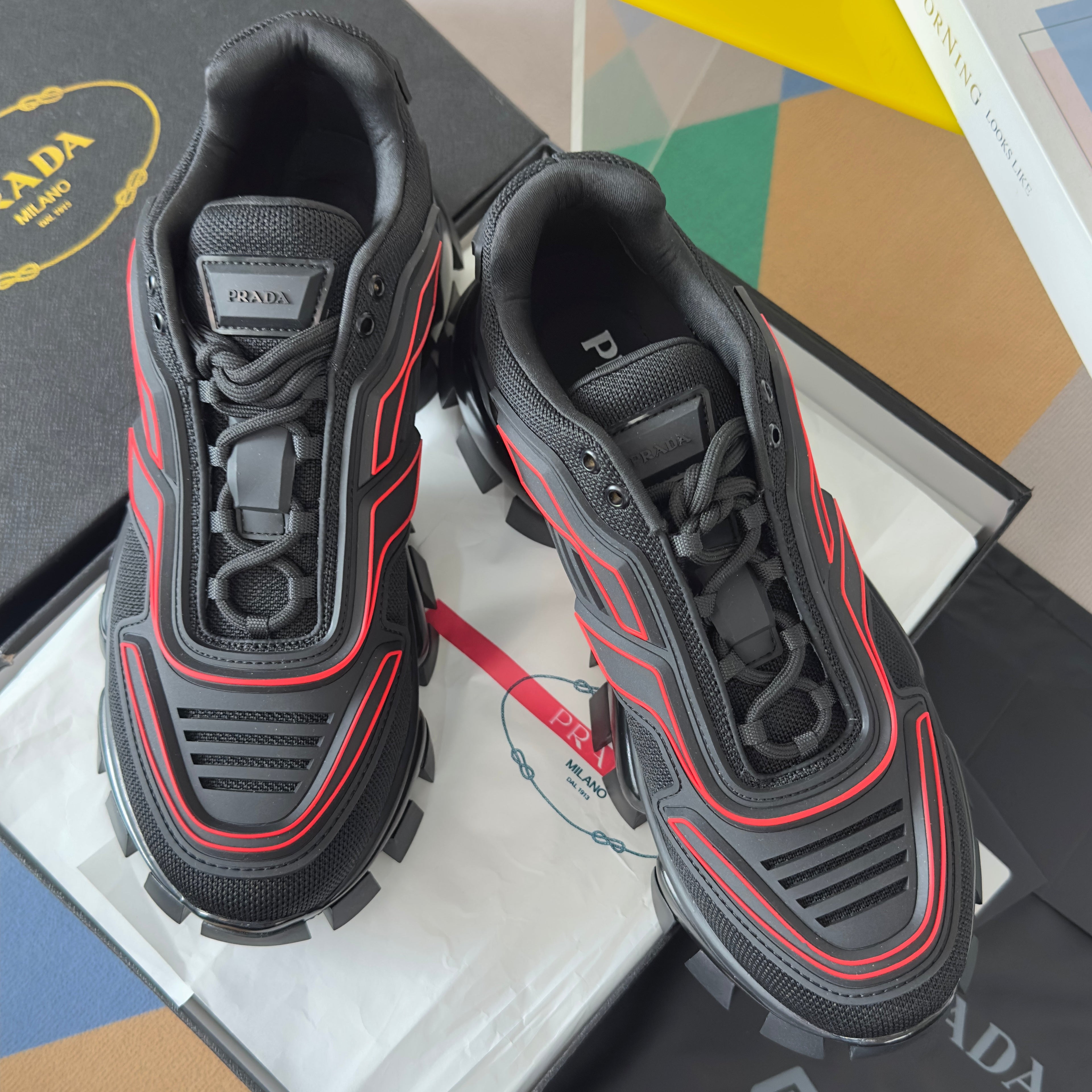 PRADA 26S CLOUDBUST THUNDER SNEAKERS 60MM IN BLACK AND RED MESH FABRIC AND TPU
