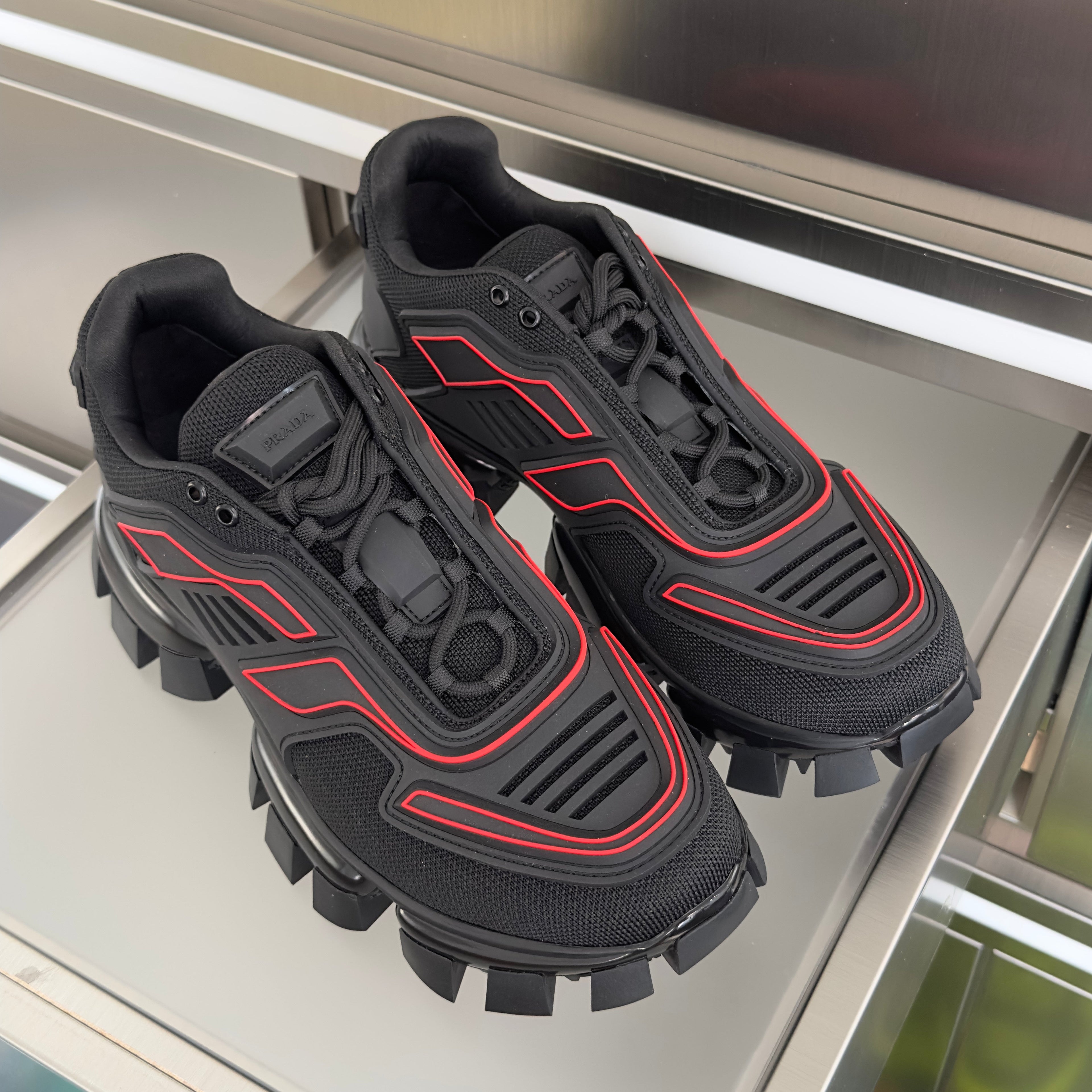 PRADA 26S CLOUDBUST THUNDER SNEAKERS 60MM IN BLACK AND RED MESH FABRIC AND TPU
