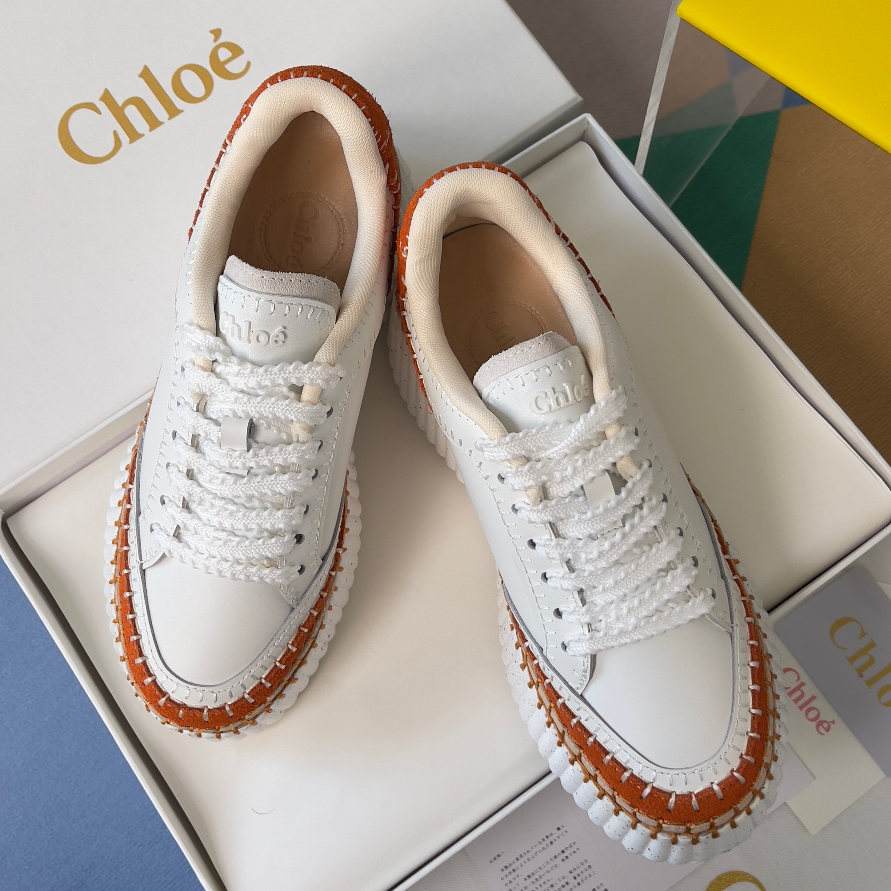 CHLOÉ 26S WEDGE SNEAKERS 70 MM IN WHITE CALFSKIN AND ORANGE SUEDE