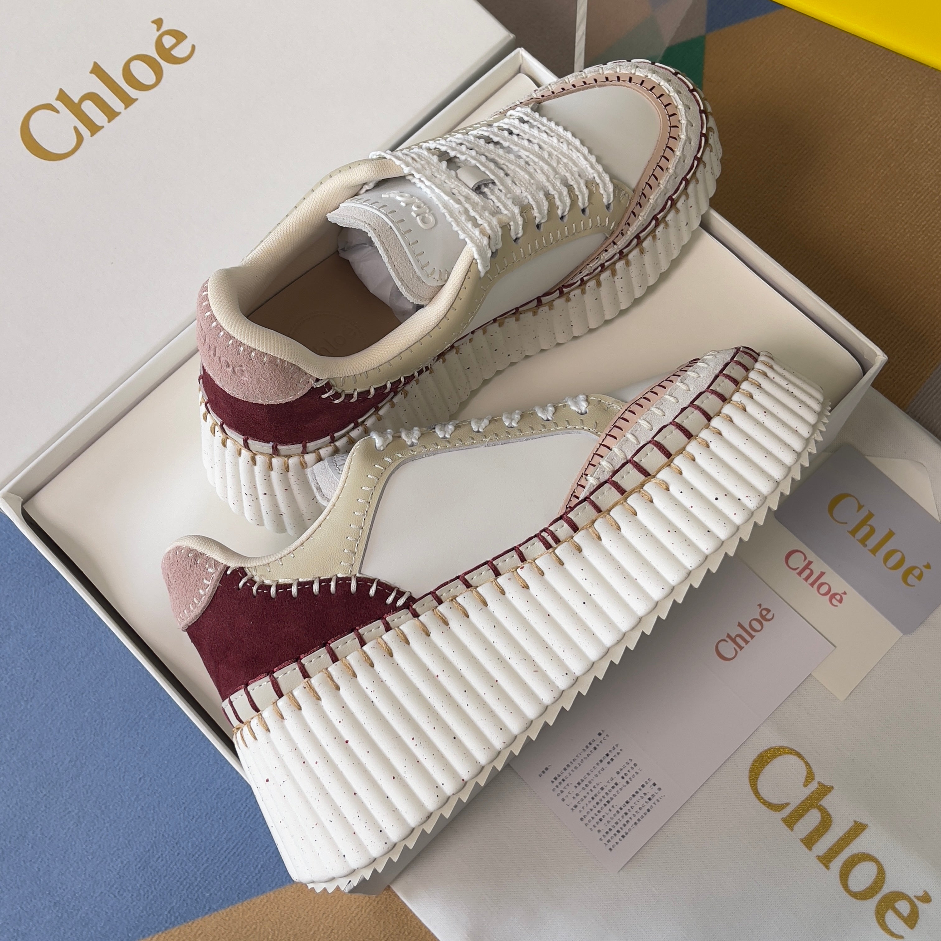 CHLOÉ 26S WEDGE SNEAKERS 70 MM IN WHITE CALFSKIN AND DARK RED SUEDE