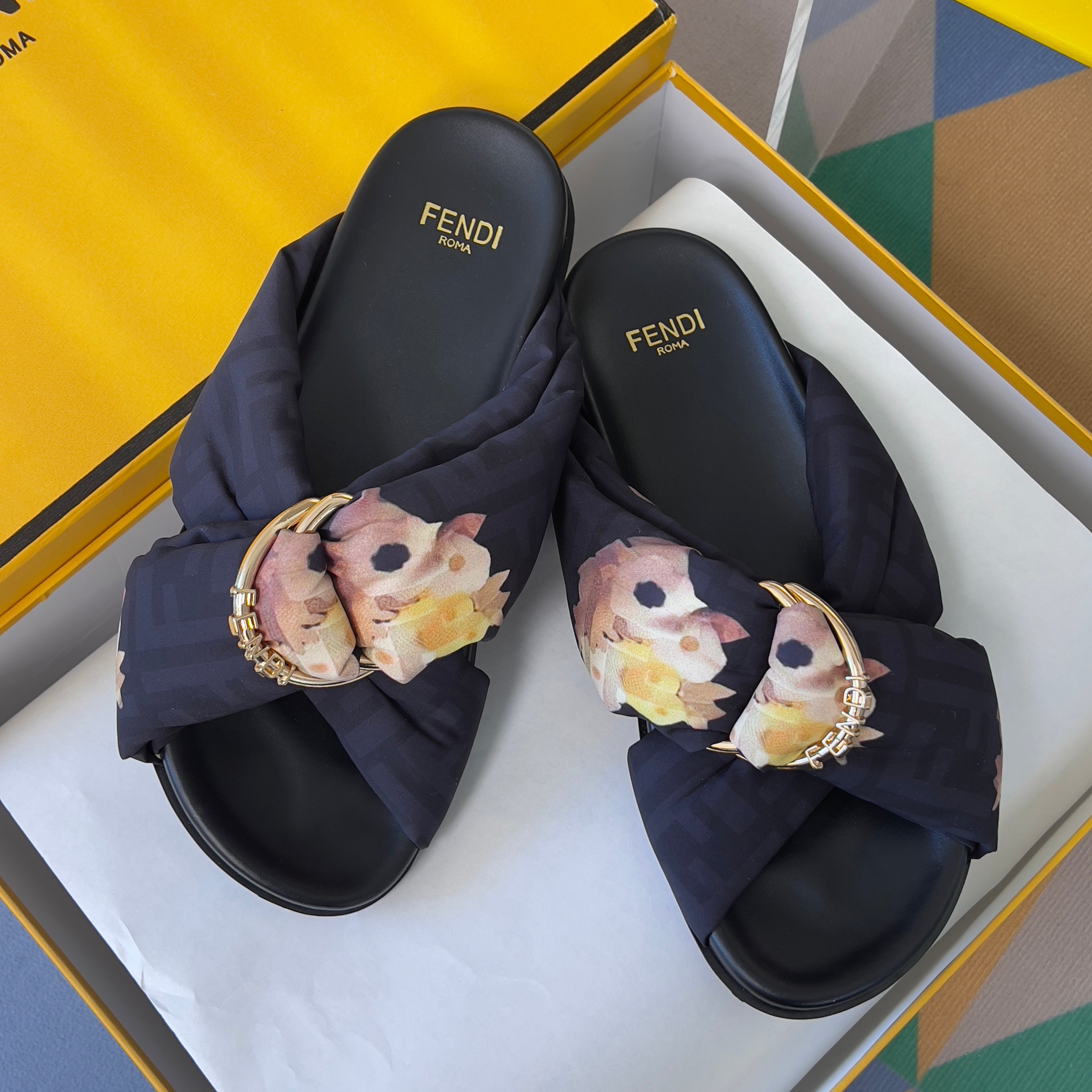 FENDI 26S PATTERNED CROSS-STRAP SLIDE SANDALS IN BLACK FABRIC