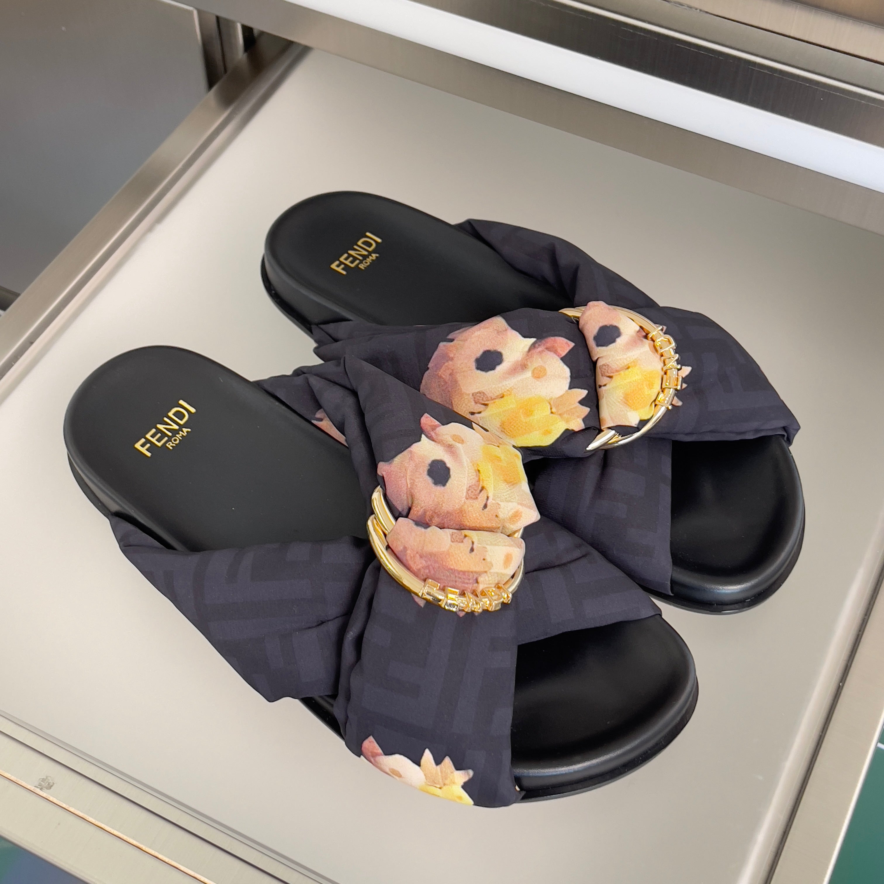 FENDI 26S PATTERNED CROSS-STRAP SLIDE SANDALS IN BLACK FABRIC