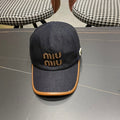 MIUMIU BASEBALL CAP IN NAVY BLUE DENIM AND CALFSKIN