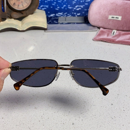 MIUMIU 26S RECTANGULAR FRAME IN METAL 426399