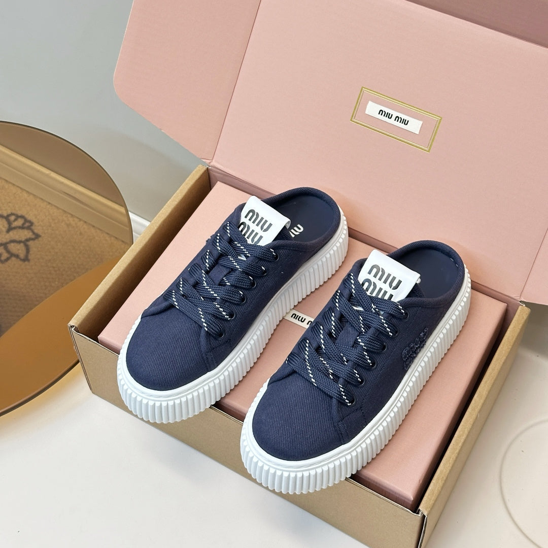 MIUMIU 26S SNEAKER MULES IN NAVY BLUE CANVAS