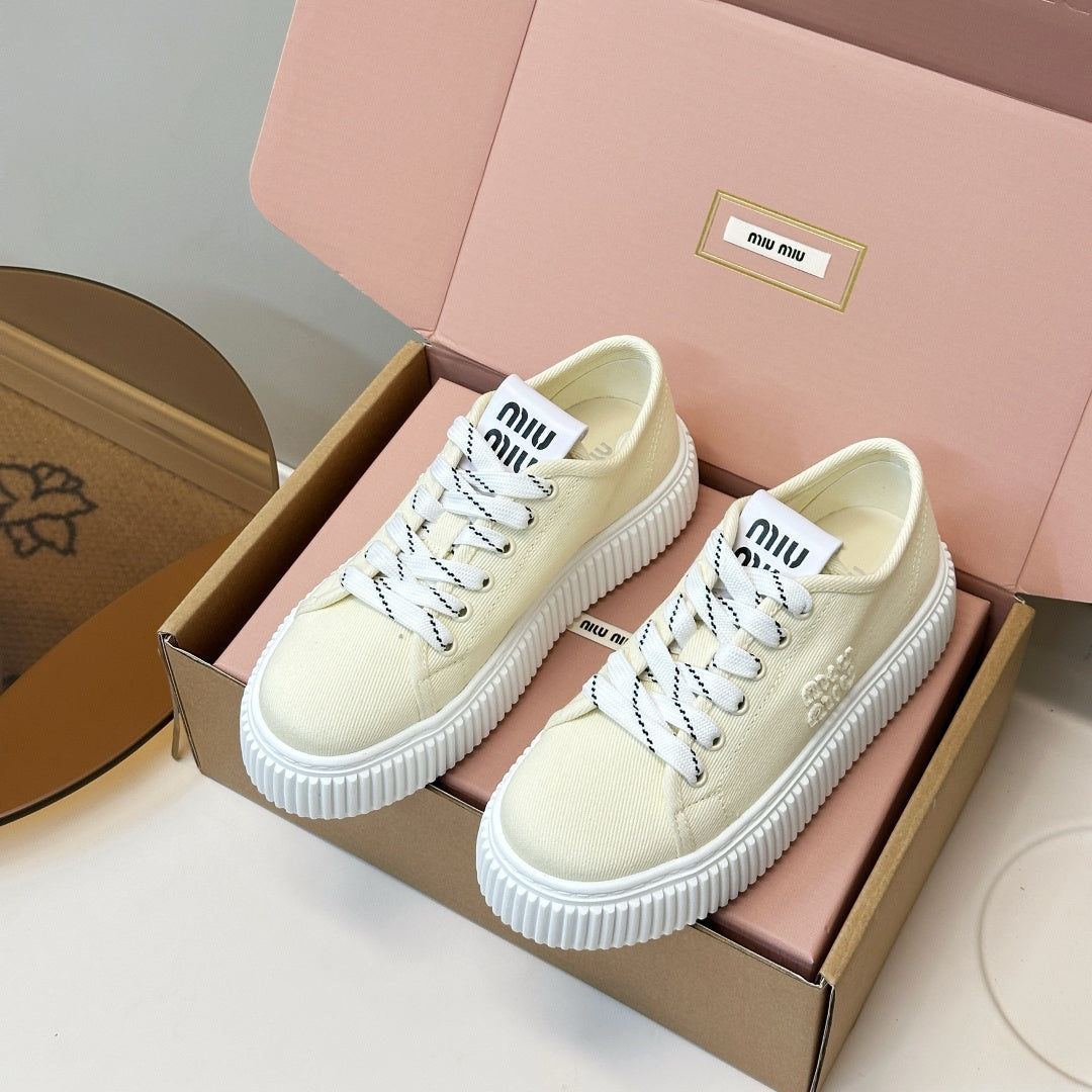 MIUMIU 26S PLATFORM SNEAKERS IN LIGHT YELLOW CANVAS