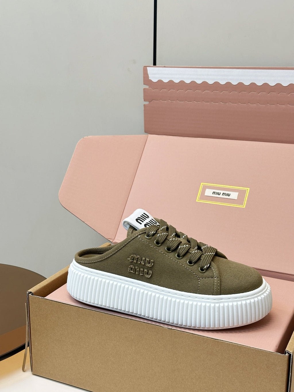 MIUMIU 26S SNEAKER MULES IN OLIVE GREEN CANVAS