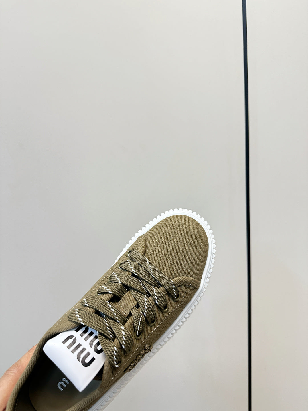 MIUMIU 26S SNEAKER MULES IN OLIVE GREEN CANVAS