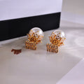 MIUMIU 26S CRYSTAL LOGO PEARL BACK STUD EARRINGS IN GOLD TONE METAL 612742