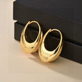 YSL 26S SCULPTED OVAL HOOP EARRINGS IN GOLD TONE METAL 615775