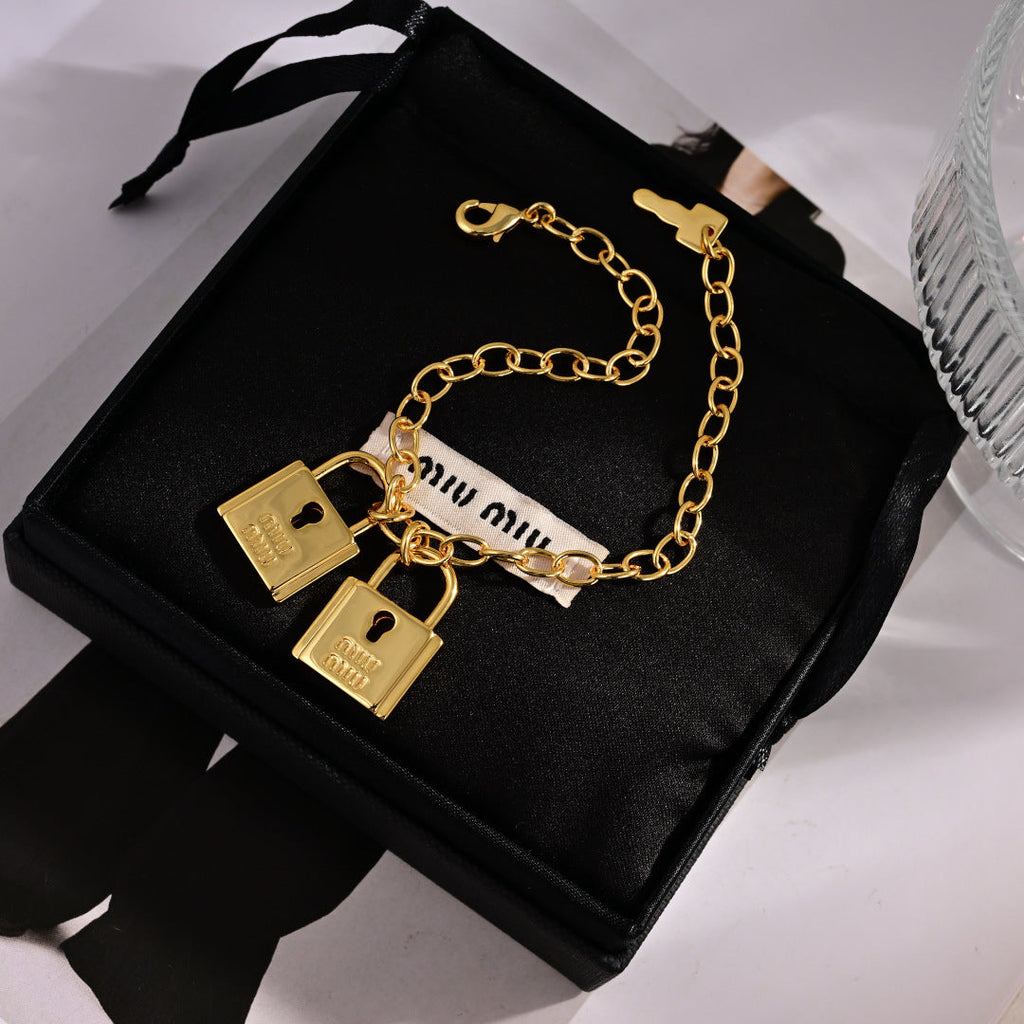 MIUMIU 26S DOUBLE PADLOCK CHARM CHAIN BRACELET IN GOLD TONE METAL 619260
