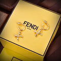 FENDI 26S RIBBON CHARM HOOP EARRINGS IN GOLD TONE METAL 621453
