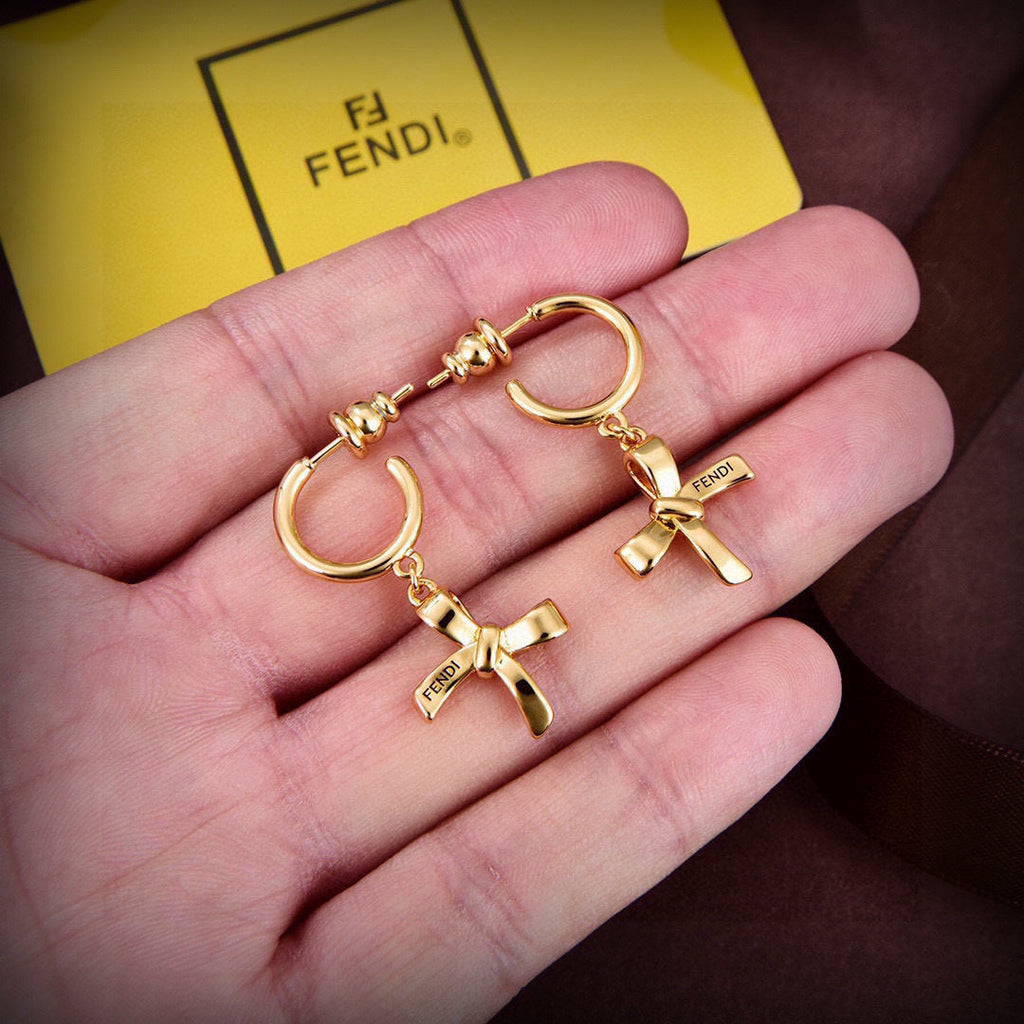 FENDI 26S RIBBON CHARM HOOP EARRINGS IN GOLD TONE METAL 621453