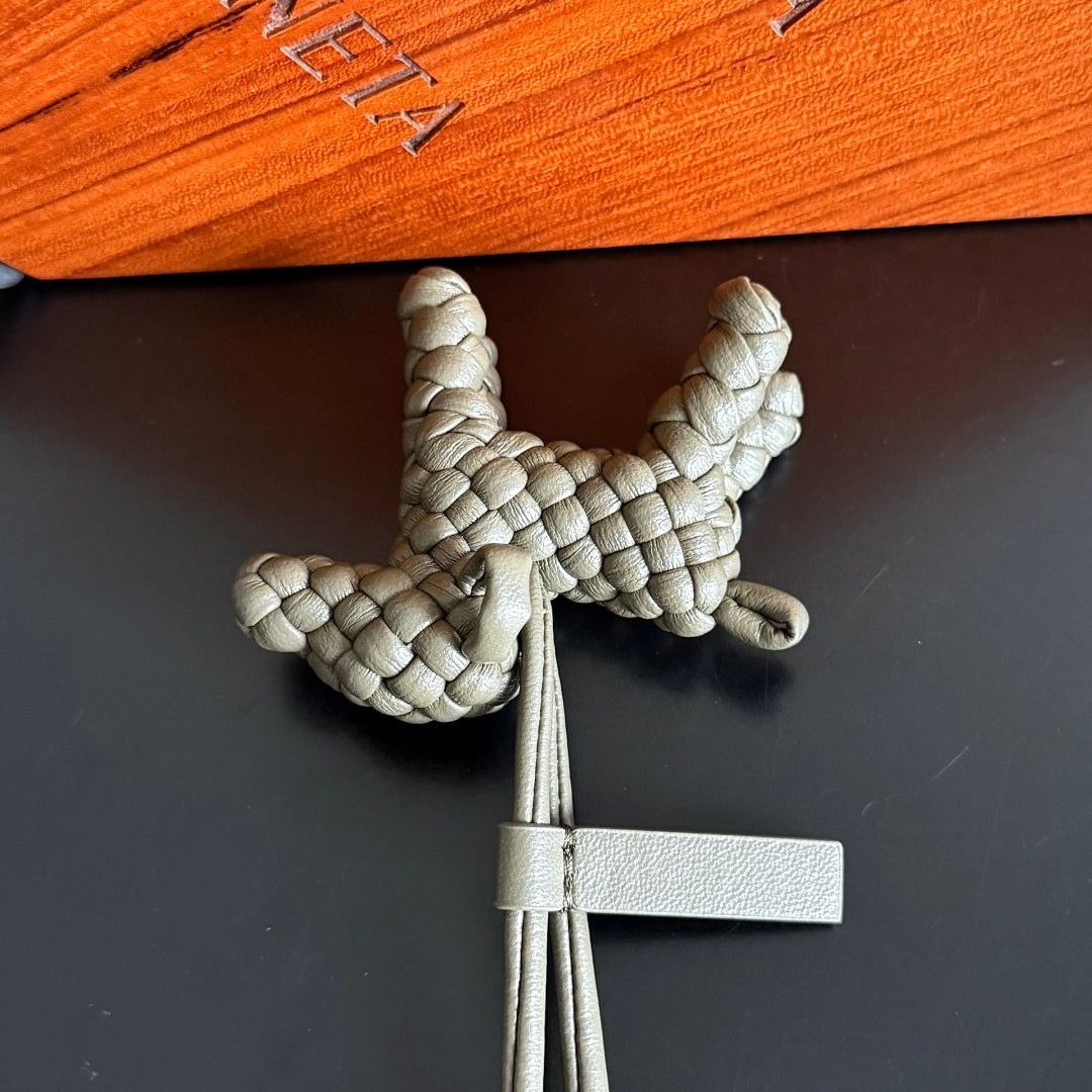 BOTTEGA VENETA 25S DOG CHARM IN GREIGE CALFSKIN