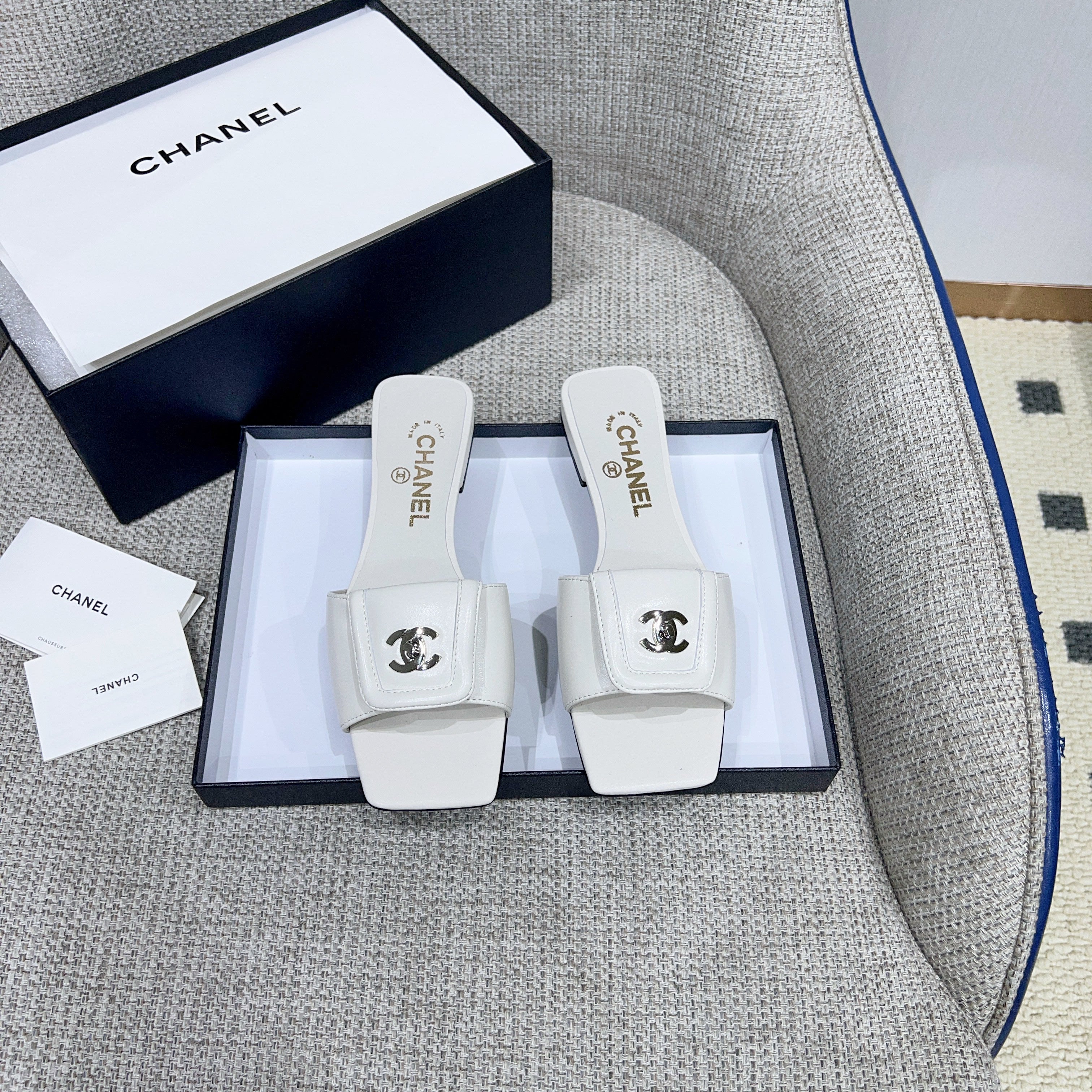 CHANEL 26S FLAT SLIDES IN WHITE LAMBSKIN