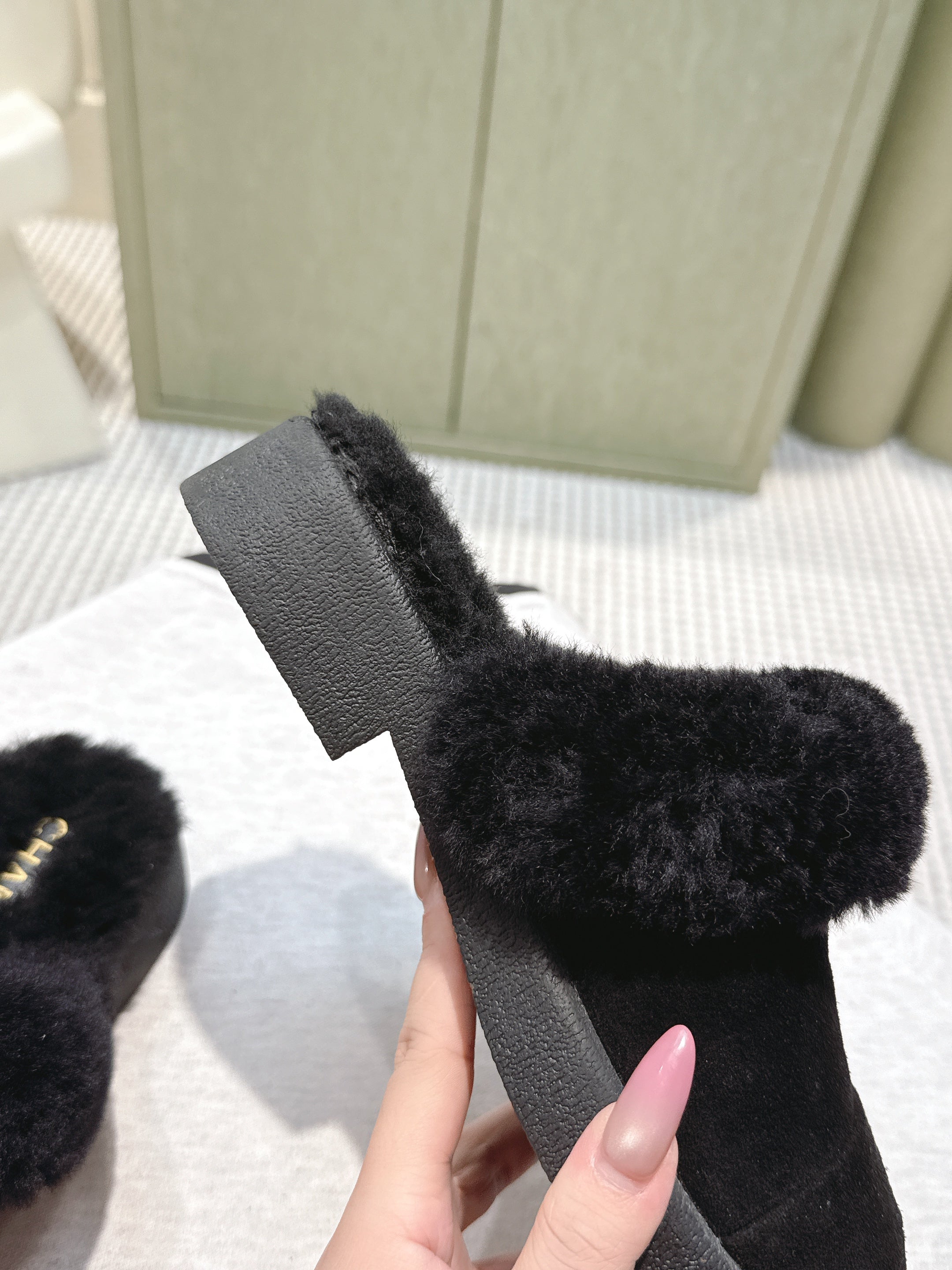 CHANEL 25S FUR-LINED MULES IN BLACK SUEDE