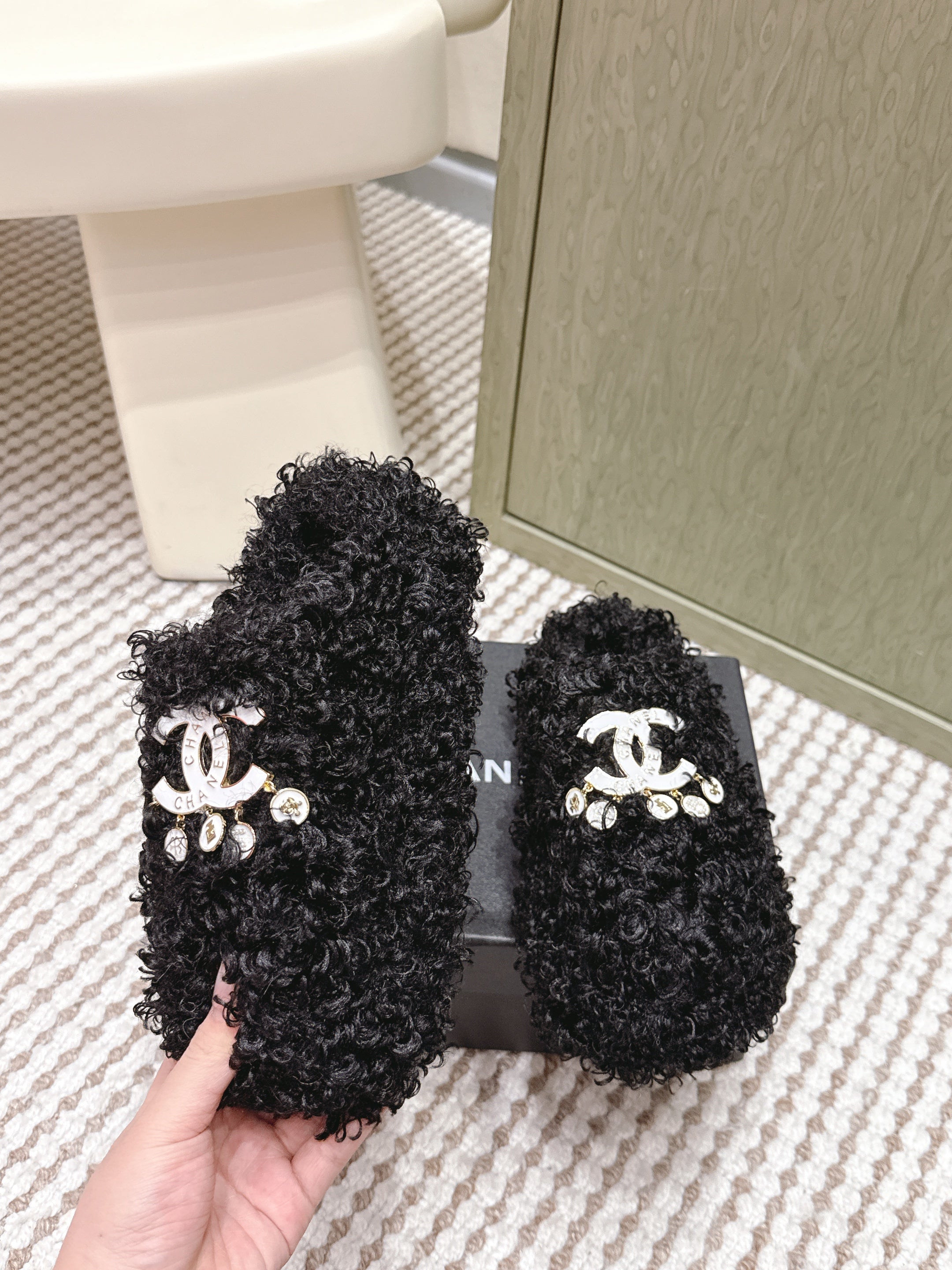 CHANEL 25S CLASSIC FURRY SLIDES IN BLACK WITH DOUBLE C LOGO
