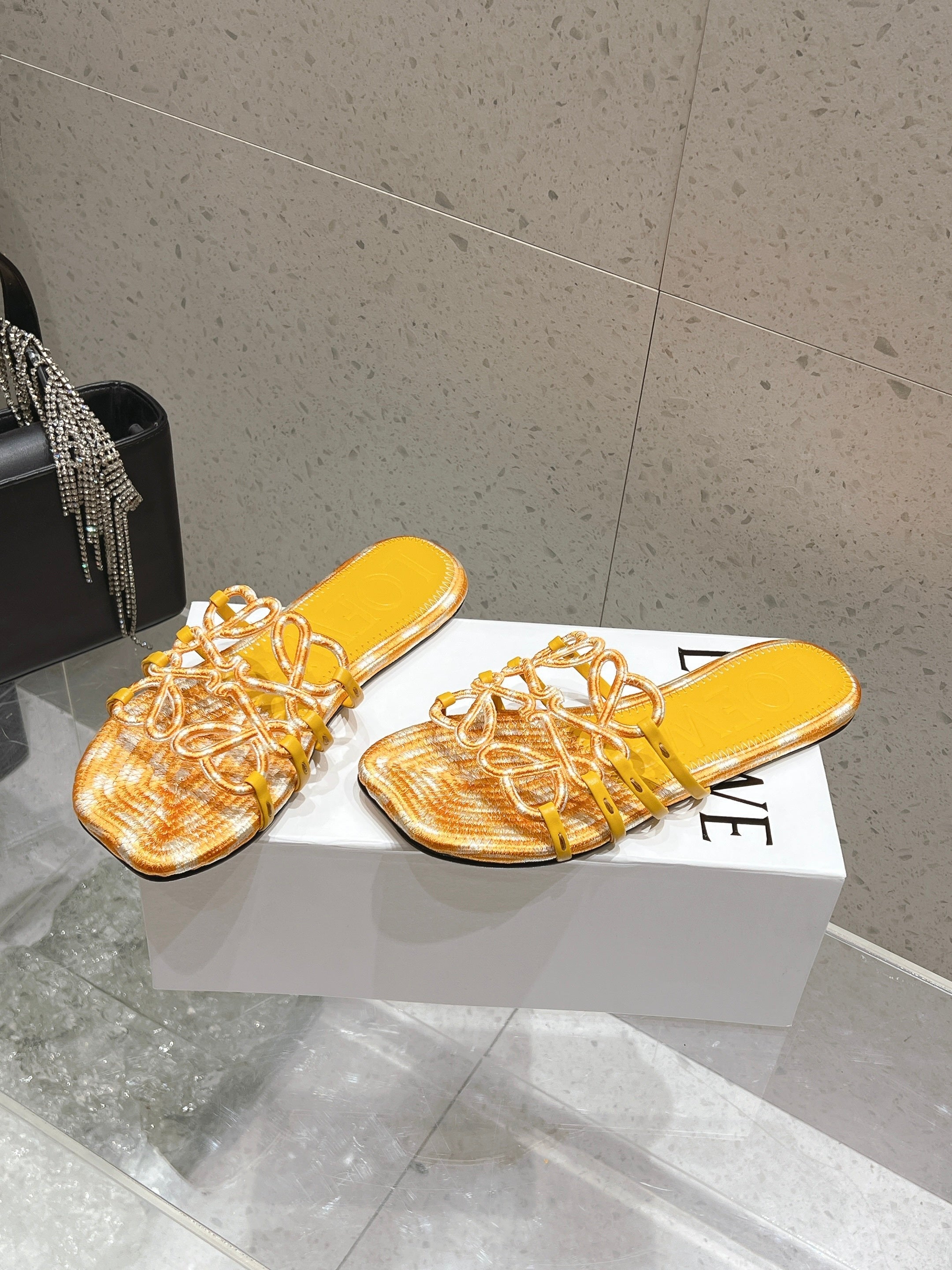LOEWE 26S BRAIDED CAGE SLIDE SANDALS IN YELLOW CALFSKIN