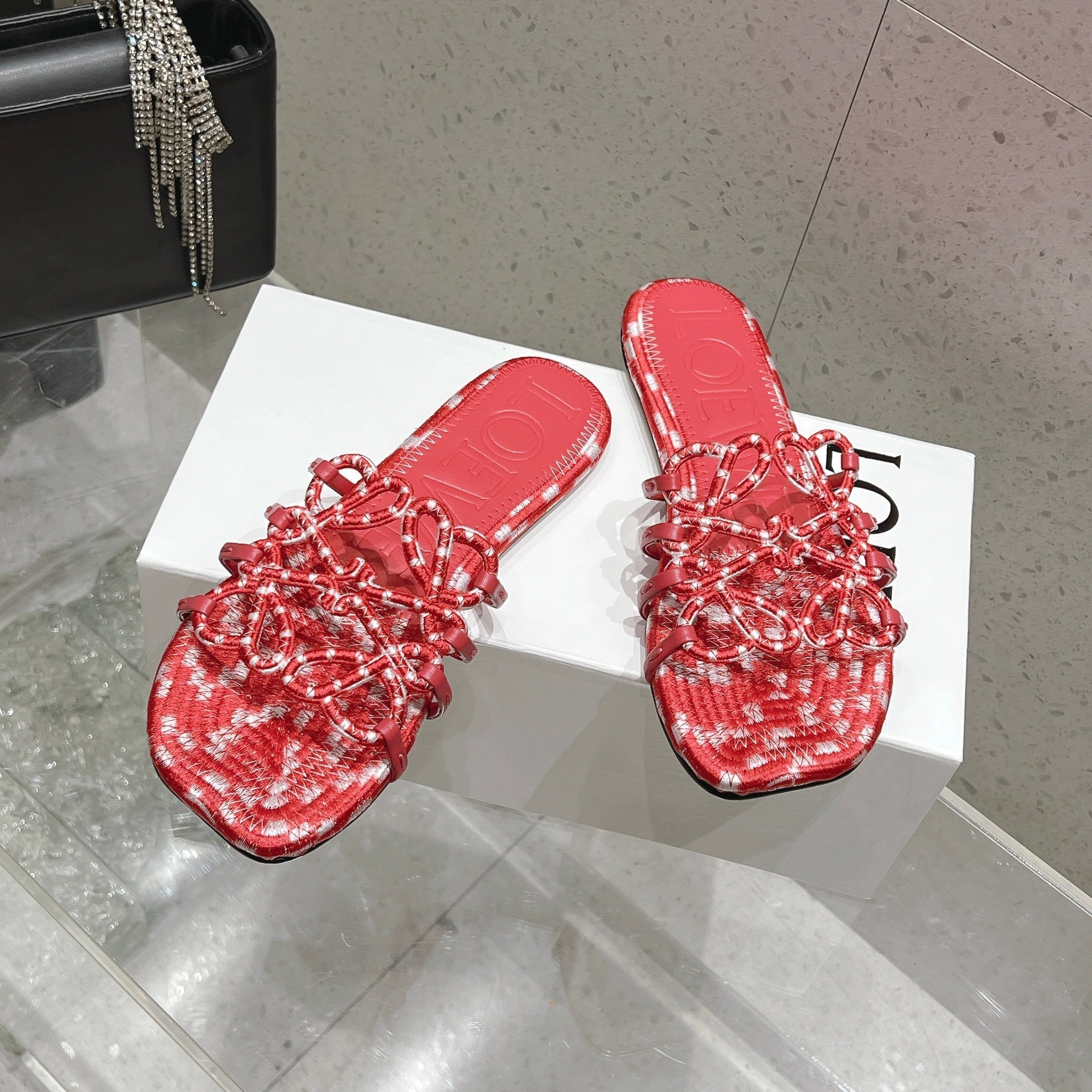 LOEWE 26S BRAIDED CAGE SLIDE SANDALS IN CORAL PINK CALFSKIN
