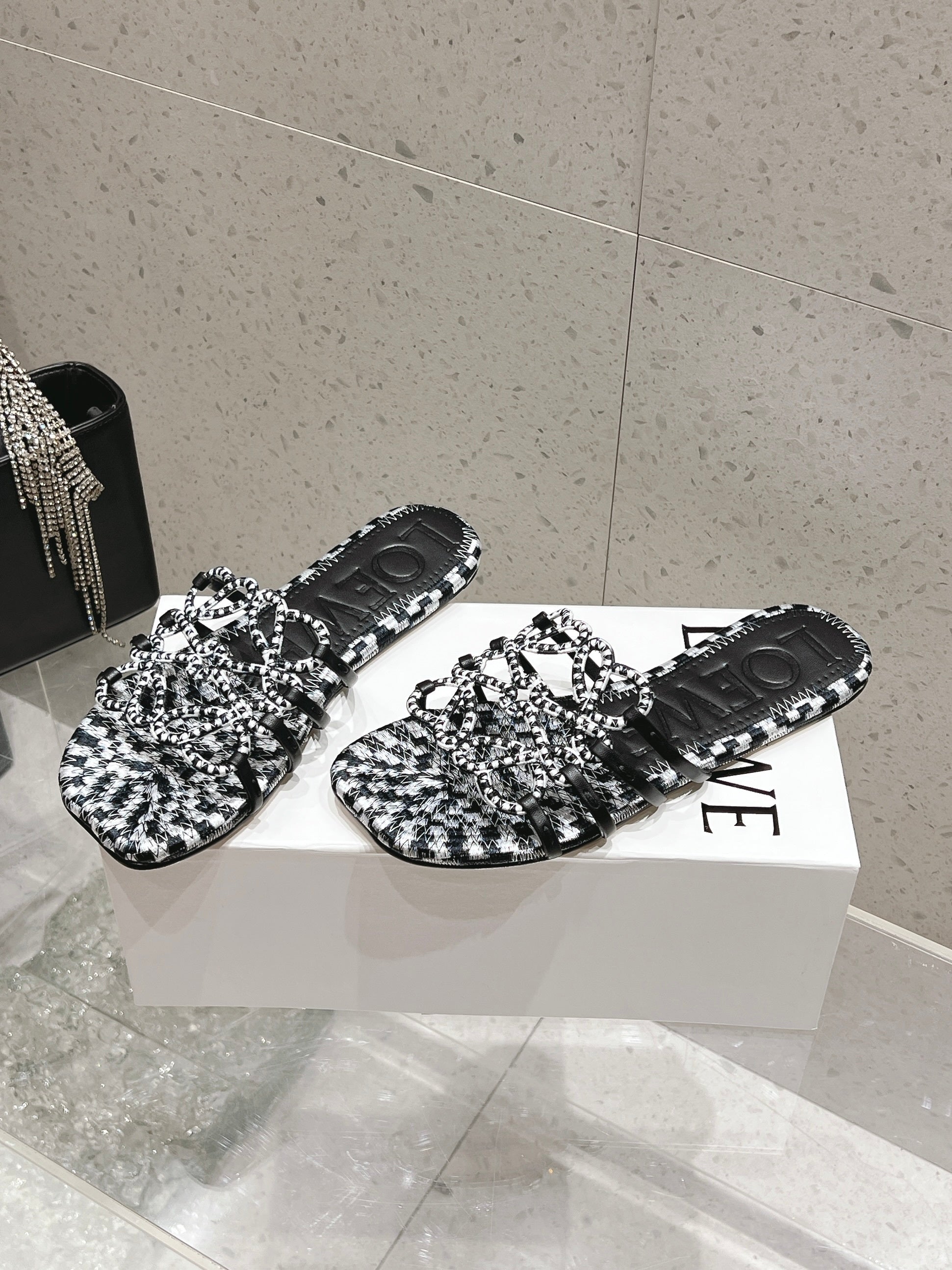 LOEWE 26S BRAIDED CAGE SLIDE SANDALS IN BLACK AND WHITE CALFSKIN
