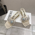 LOEWE 26S MULE HEELS 45MM IN GOLD PVC WITH CRYSTAL FLORAL