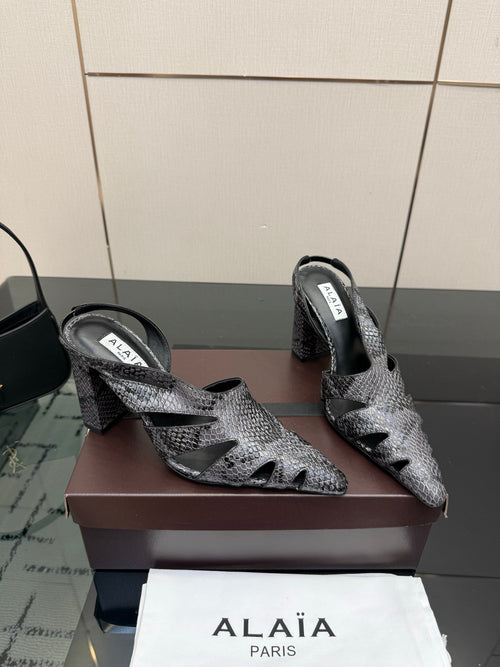 ALAIA 26S HEELED SLINGBACKS IN BLACK PYTHON-EMBOSSED LEATHER
