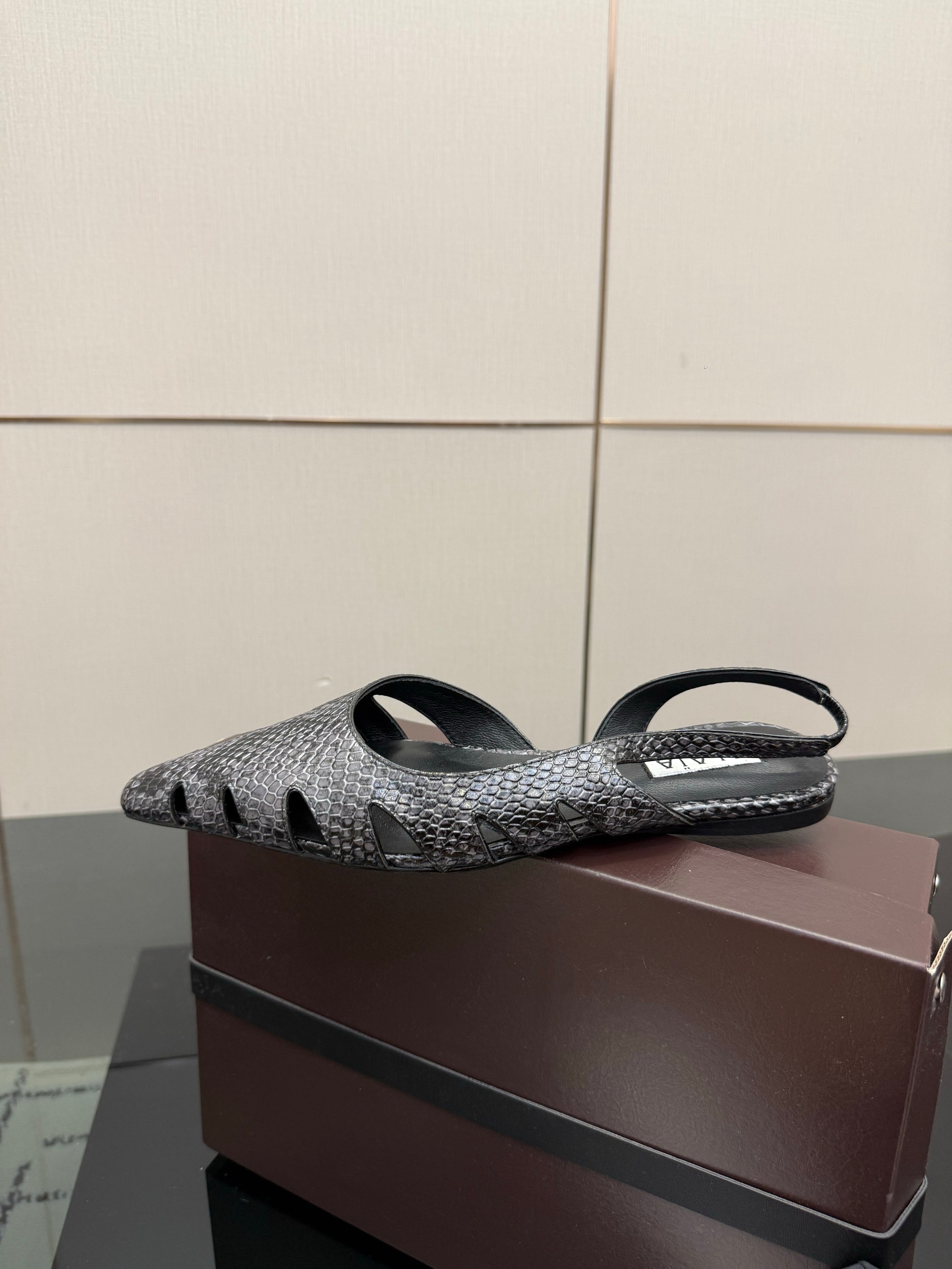 ALAIA 26S CUT-OUT SLINGBACK FLATS IN BLACK PYTHON-EMBOSSED LEATHER
