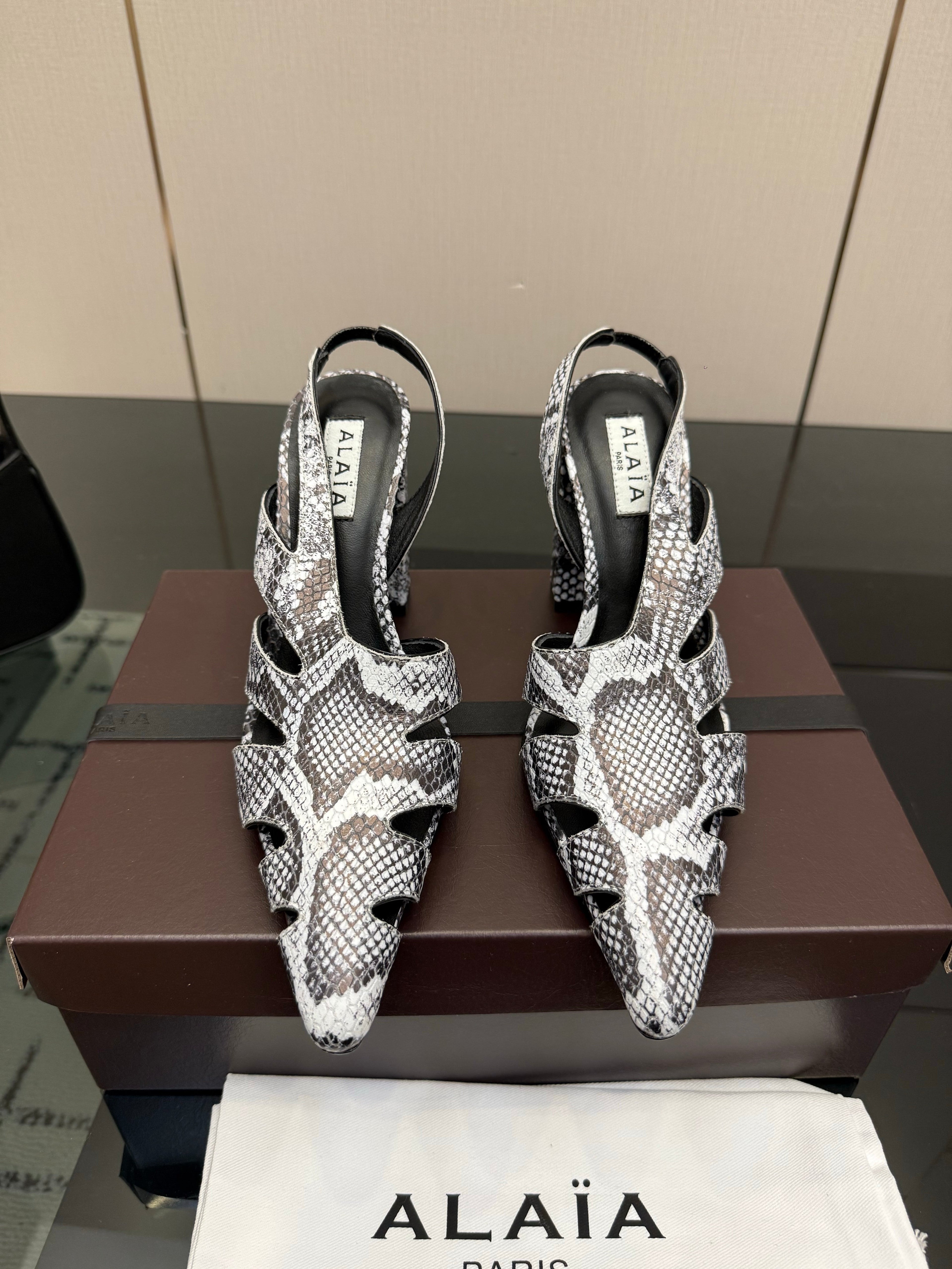 ALAIA 26S HEELED SLINGBACKS IN PYTHON-EMBOSSED LEATHER