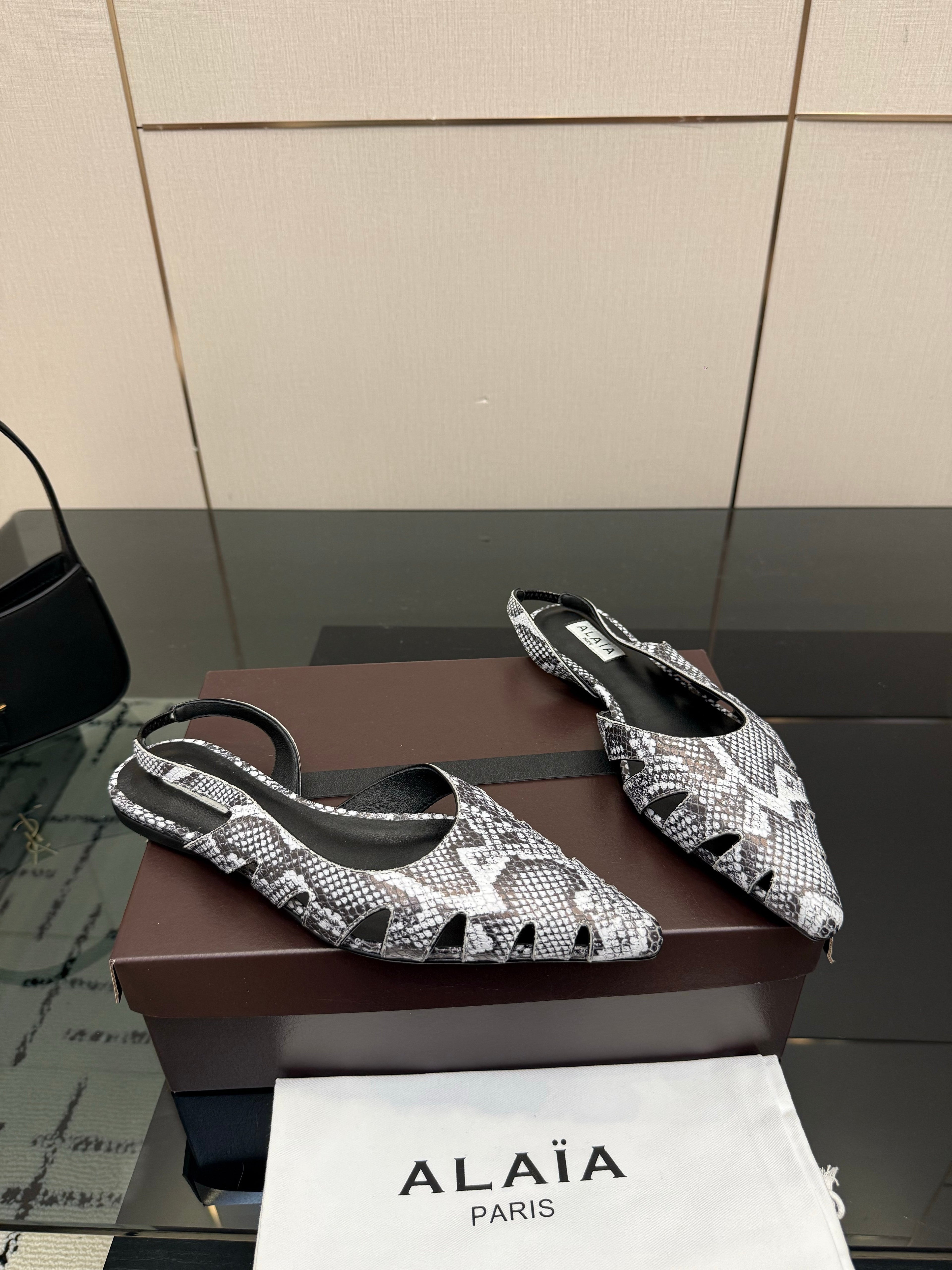 ALAIA 26S CUT-OUT SLINGBACK FLATS IN PYTHON-EMBOSSED LEATHER