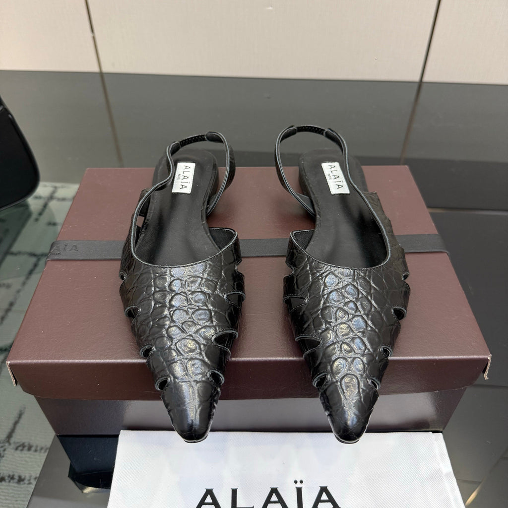 ALAIA 26S CUT-OUT SLINGBACK FLATS IN BLACK CROC-EMBOSSED LEATHER