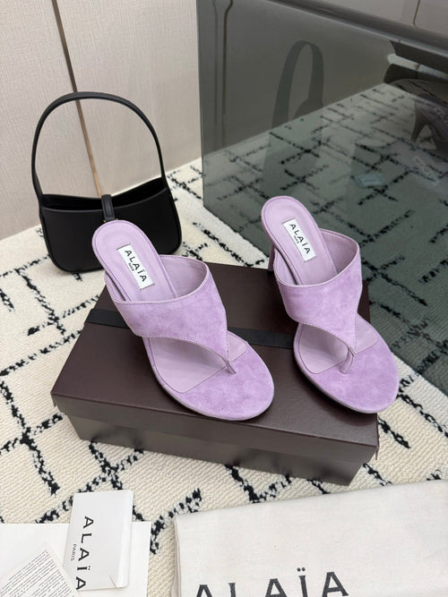 ALAIA 26S HEELED THONG MULE SANDALS IN PURPLE SUEDE