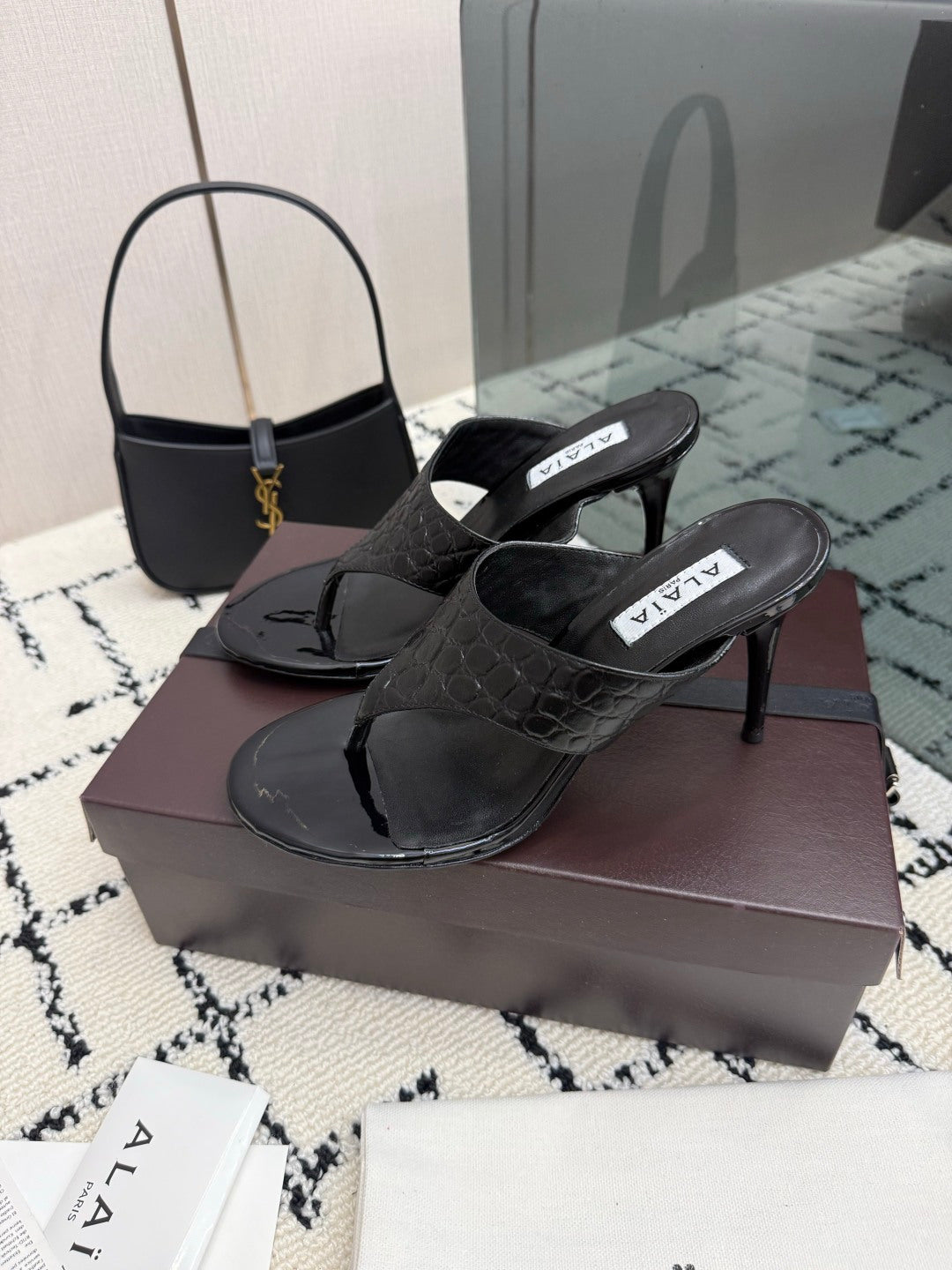 ALAIA 26S HEELED THONG MULE SANDALS IN BLACK CALFSKIN