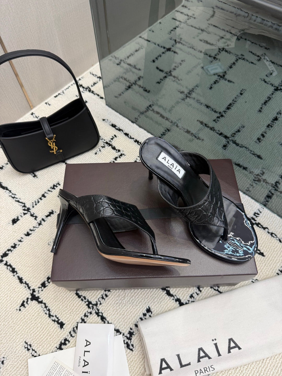 ALAIA 26S HEELED THONG MULE SANDALS IN BLACK CALFSKIN