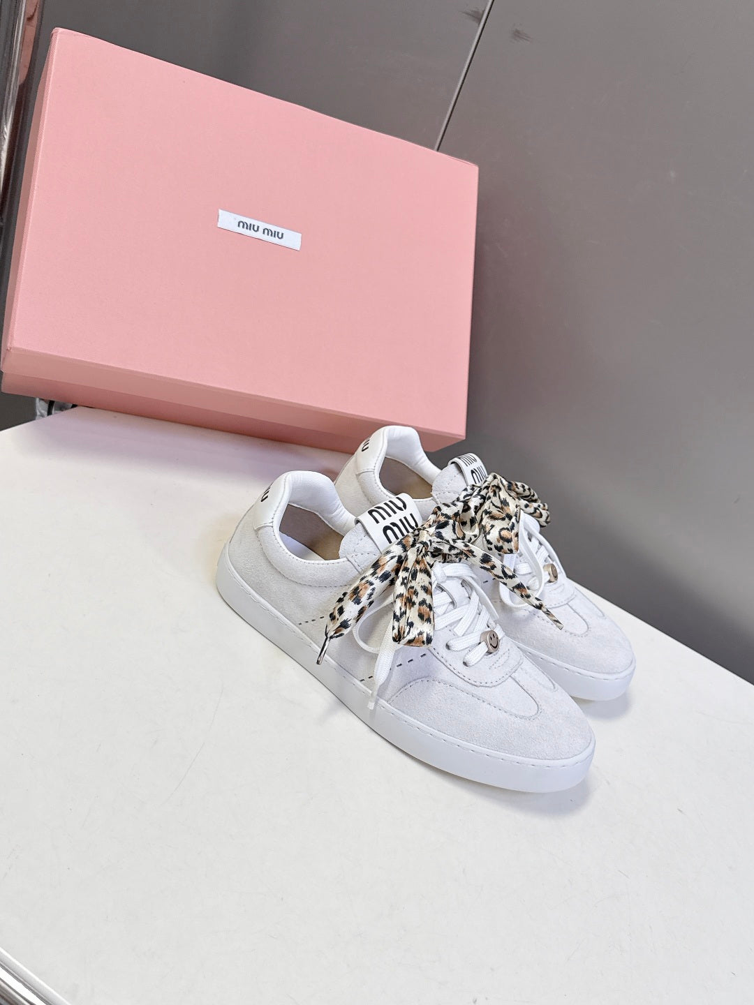 MIUMIU 25S SNEAKERS IN WHITE SUEDE WITH LEOPARD-PRINT LACES