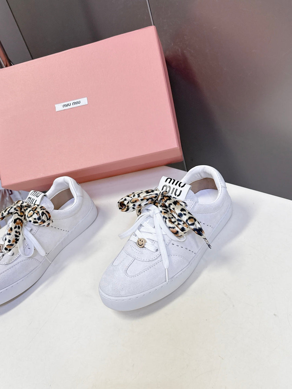 MIUMIU 25S SNEAKERS IN WHITE SUEDE WITH LEOPARD-PRINT LACES