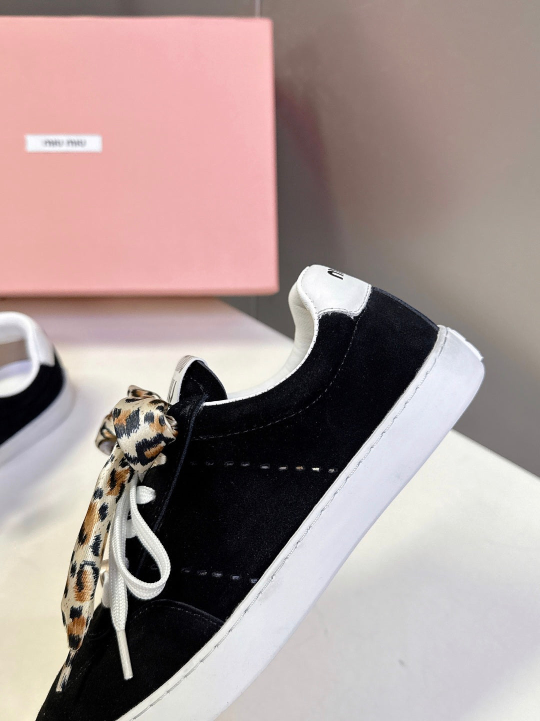 MIUMIU 25S SNEAKERS IN BLACK SUEDE WITH LEOPARD-PRINT LACES