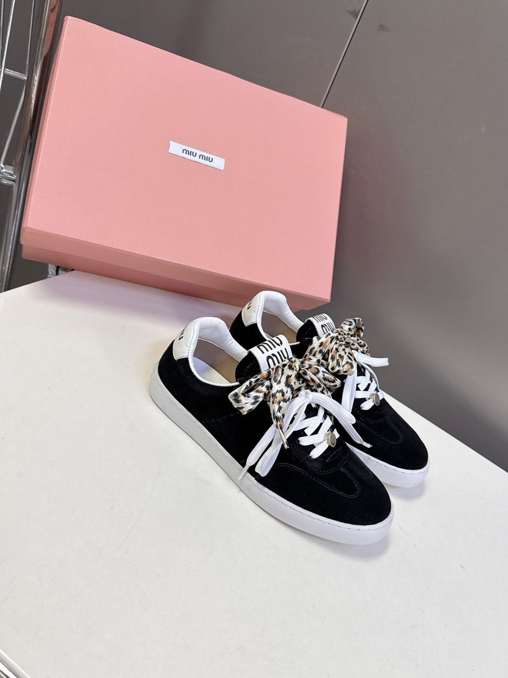 MIUMIU 25S SNEAKERS IN BLACK SUEDE WITH LEOPARD-PRINT LACES