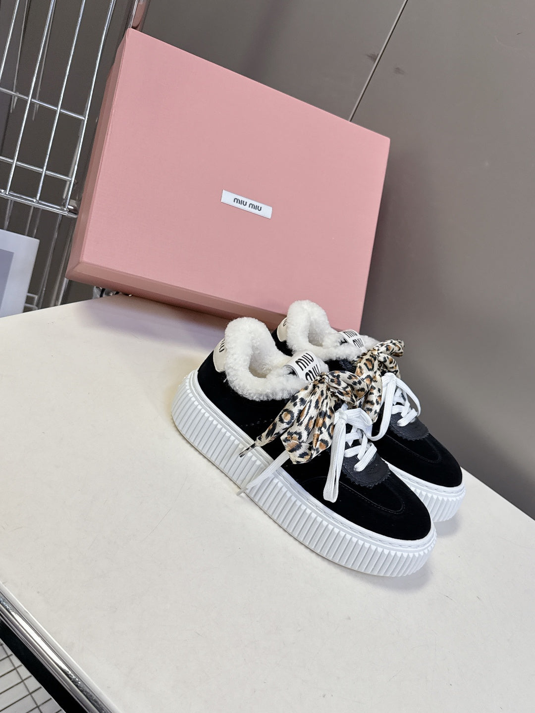 MIUMIU 25S SNEAKERS 45MM IN BLACK SUEDE WITH LEOPARD-PRINT LACES SHEARLING