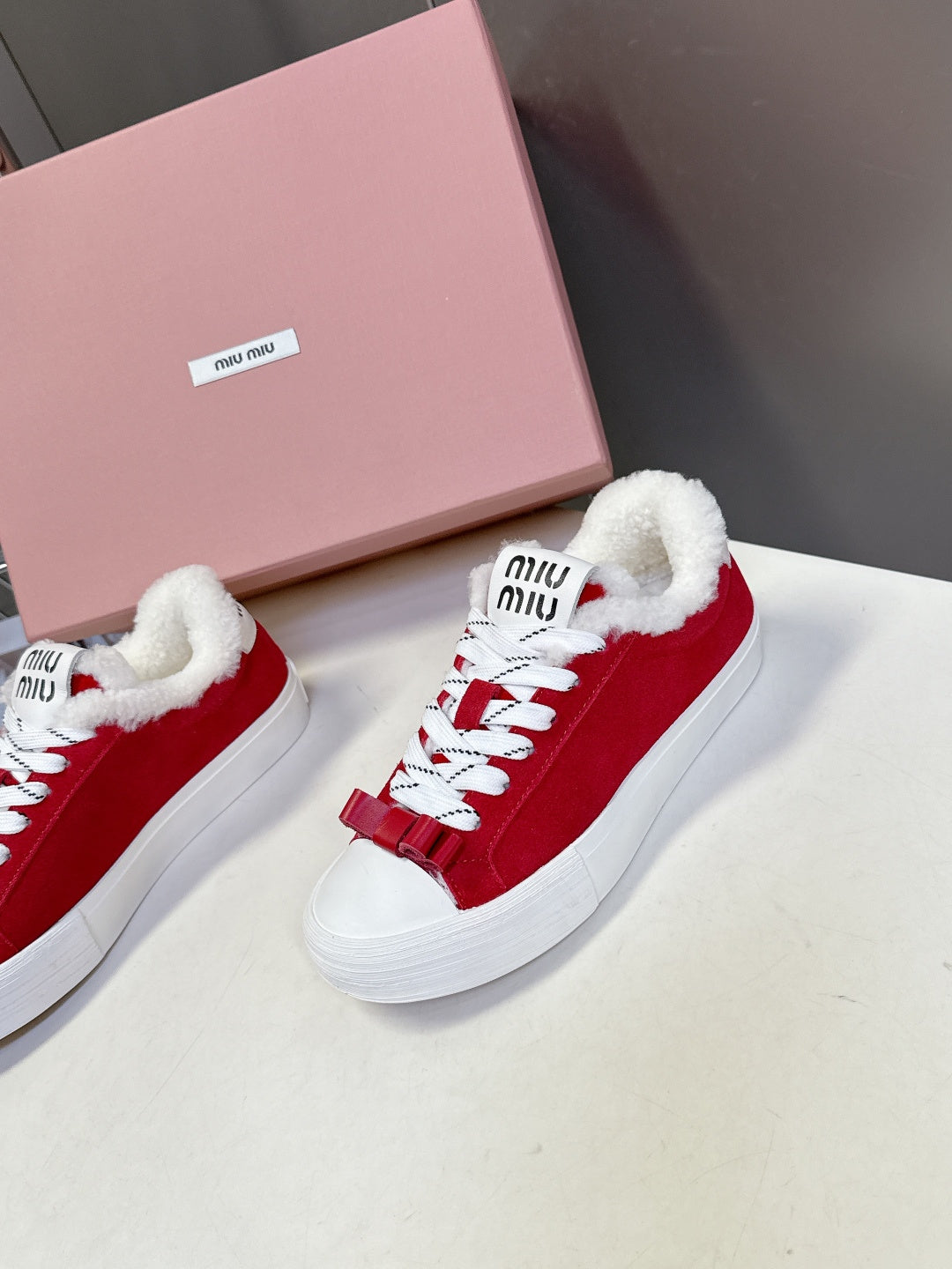 MIUMIU 25S SNEAKERS IN DARK RED SUEDE WITH SHEARLING