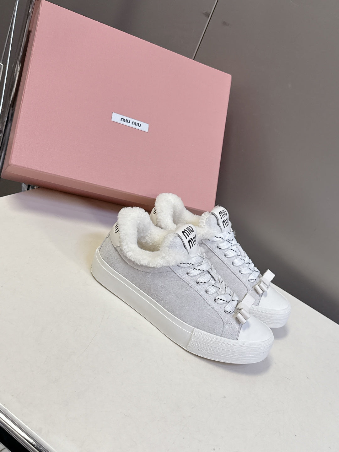 MIUMIU 25S SNEAKERS IN WHITE SUEDE WITH SHEARLING