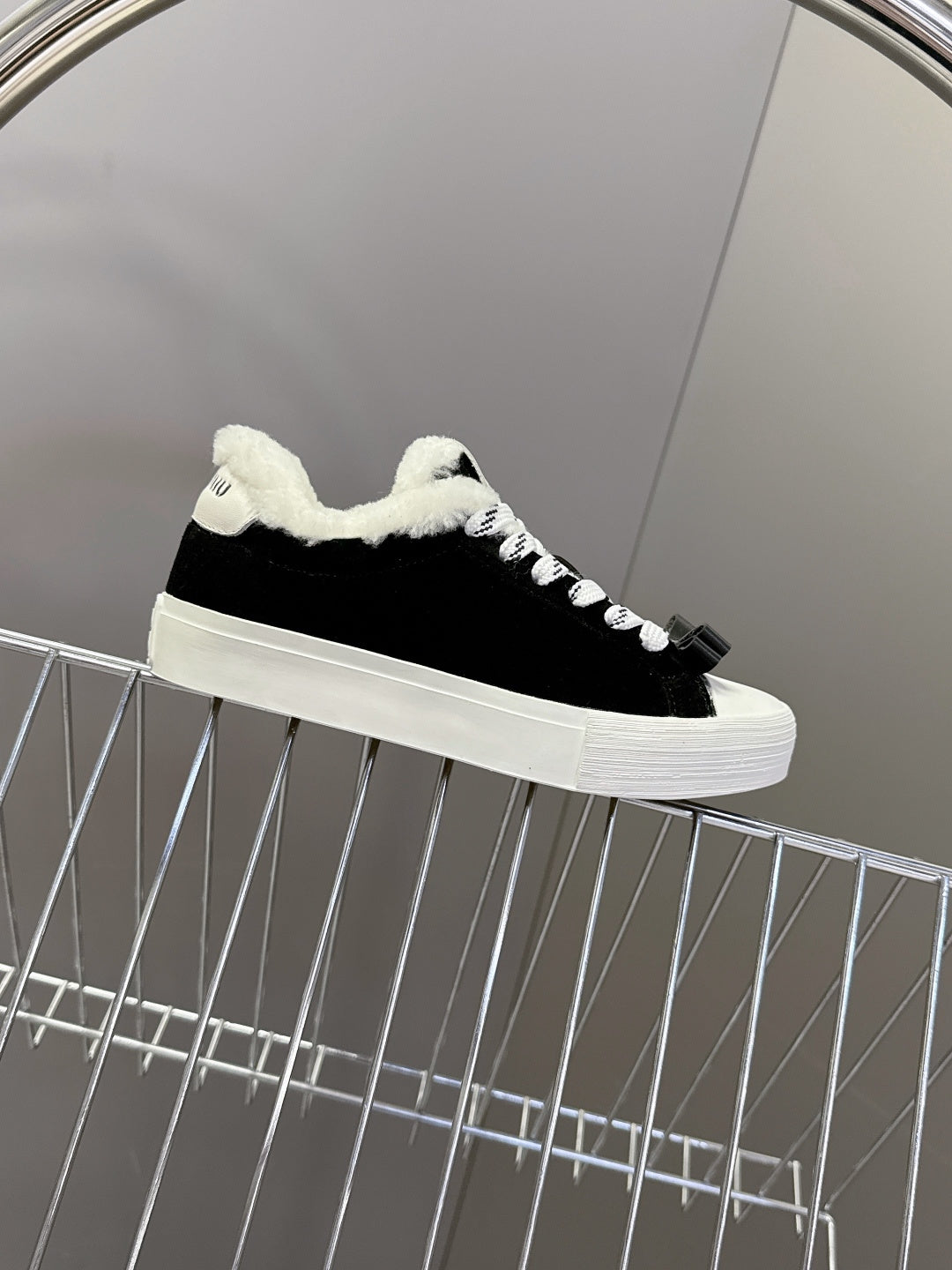 MIUMIU 25S SNEAKERS IN BLACK SUEDE WITH SHEARLING